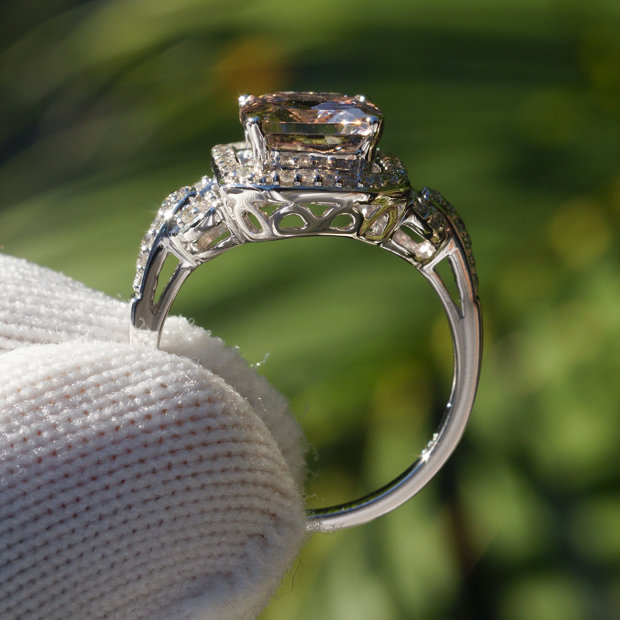 Cushion morganite ring with diamond halo on white gold