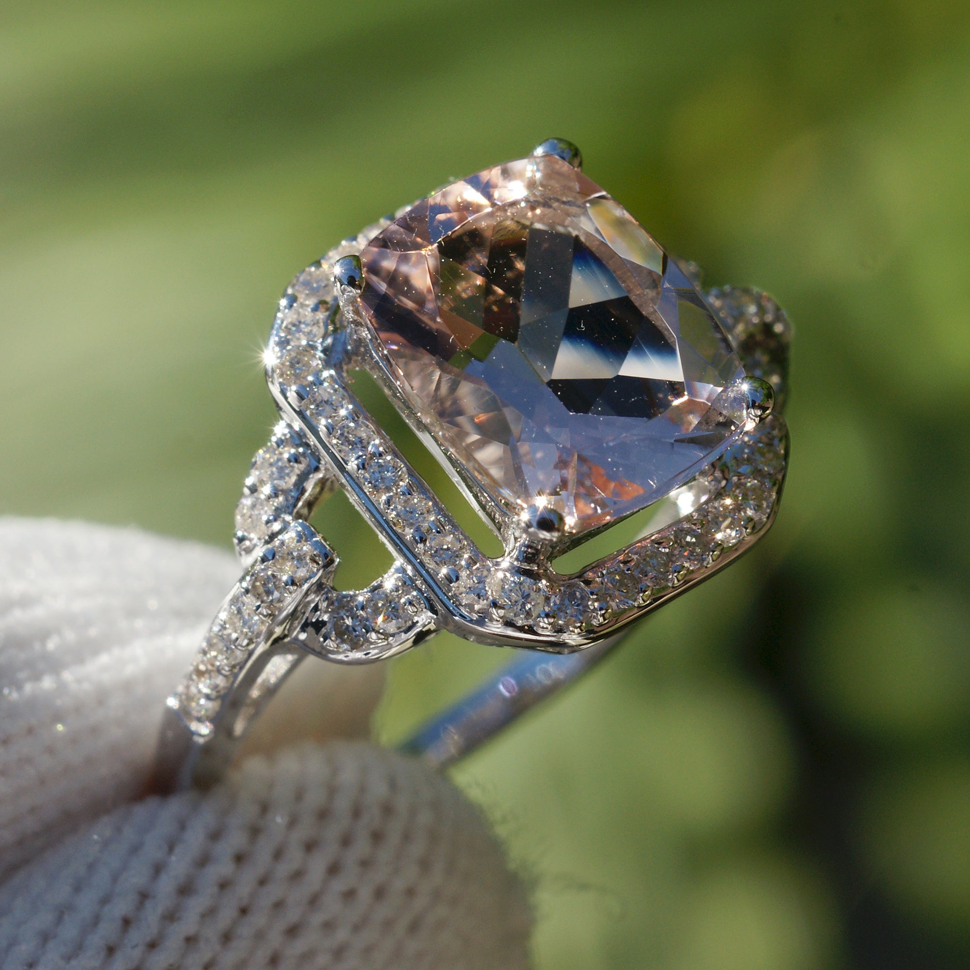Cushion morganite ring with diamond halo on white gold