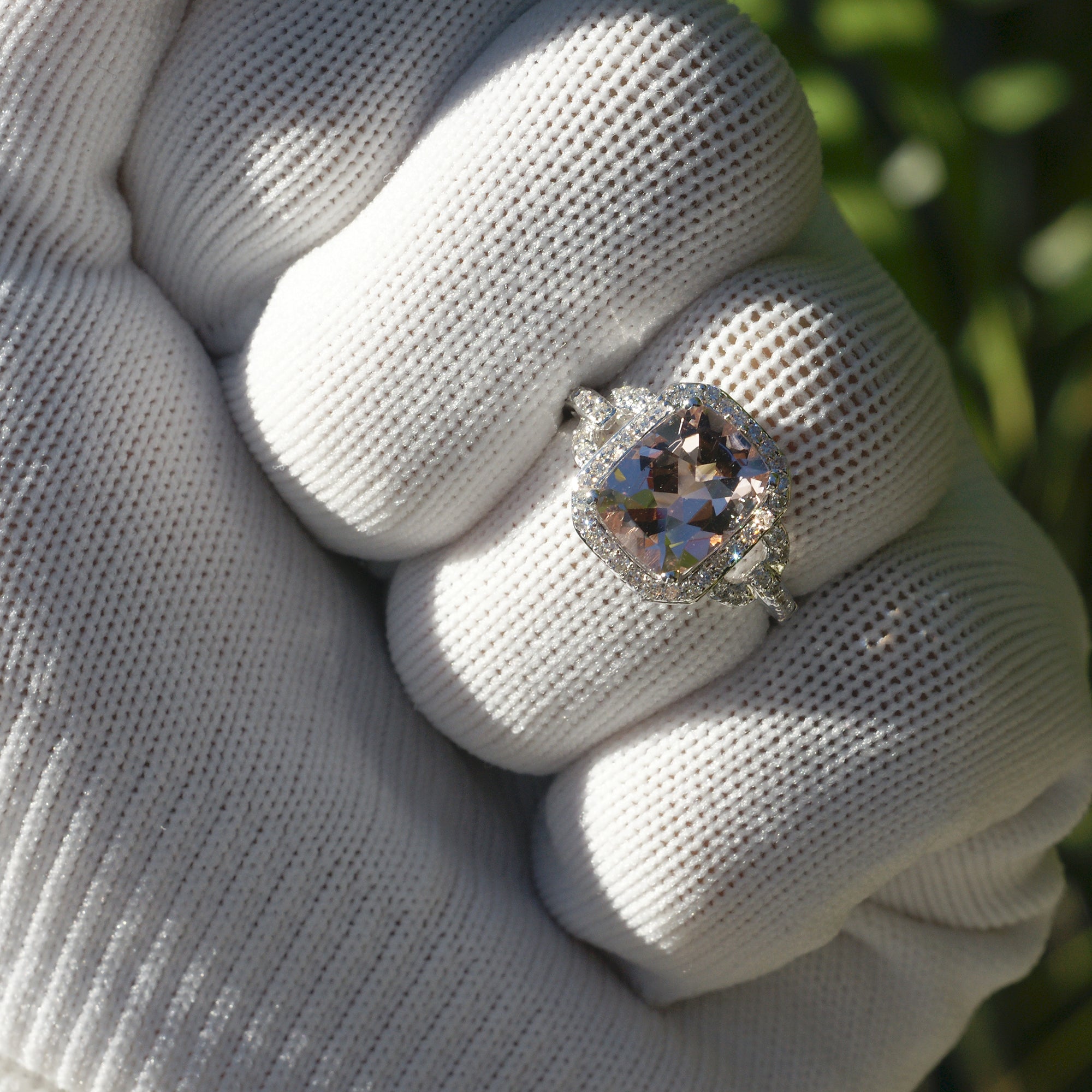 Cushion morganite ring with diamond halo on white gold