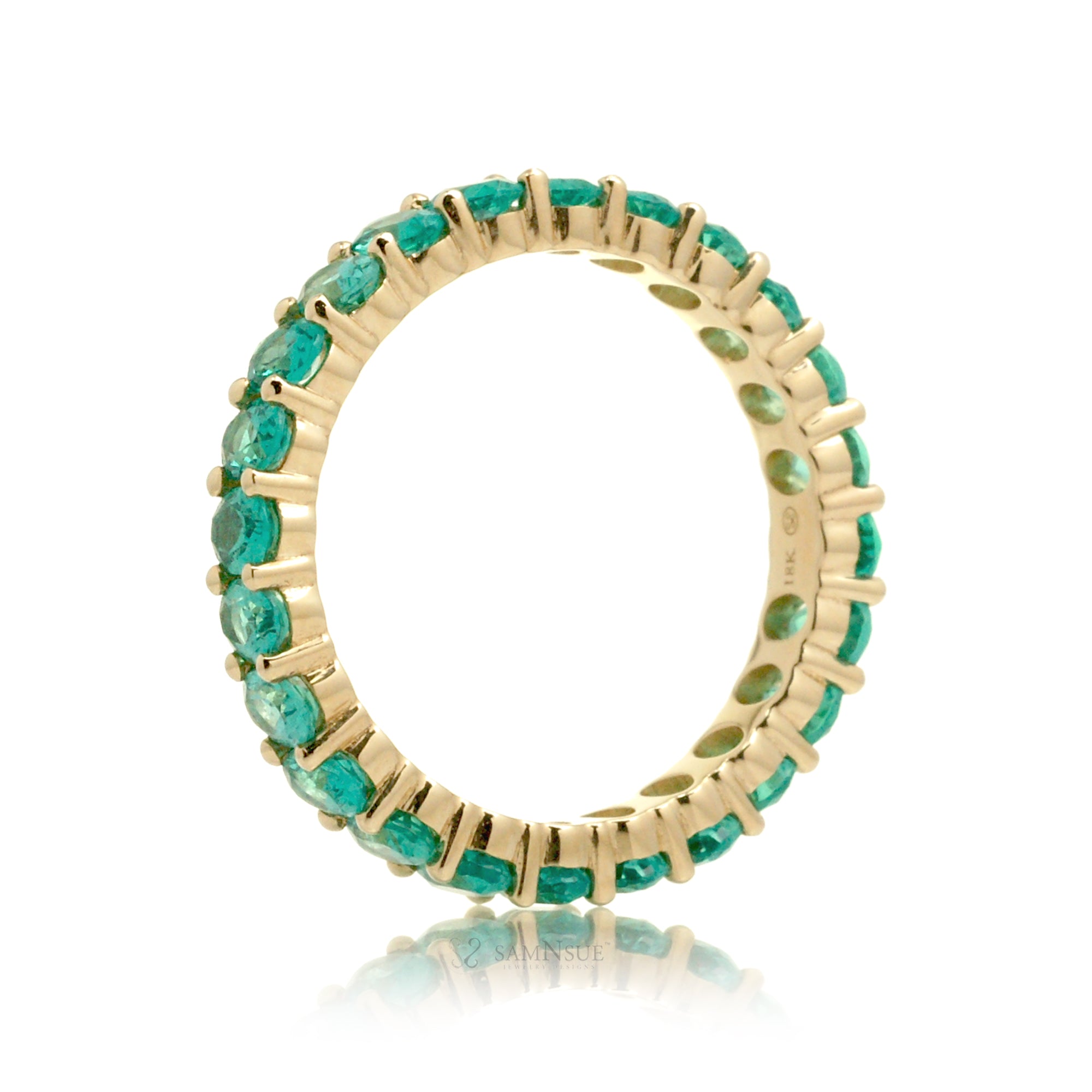 Emerald oval cut eternity band yellow gold