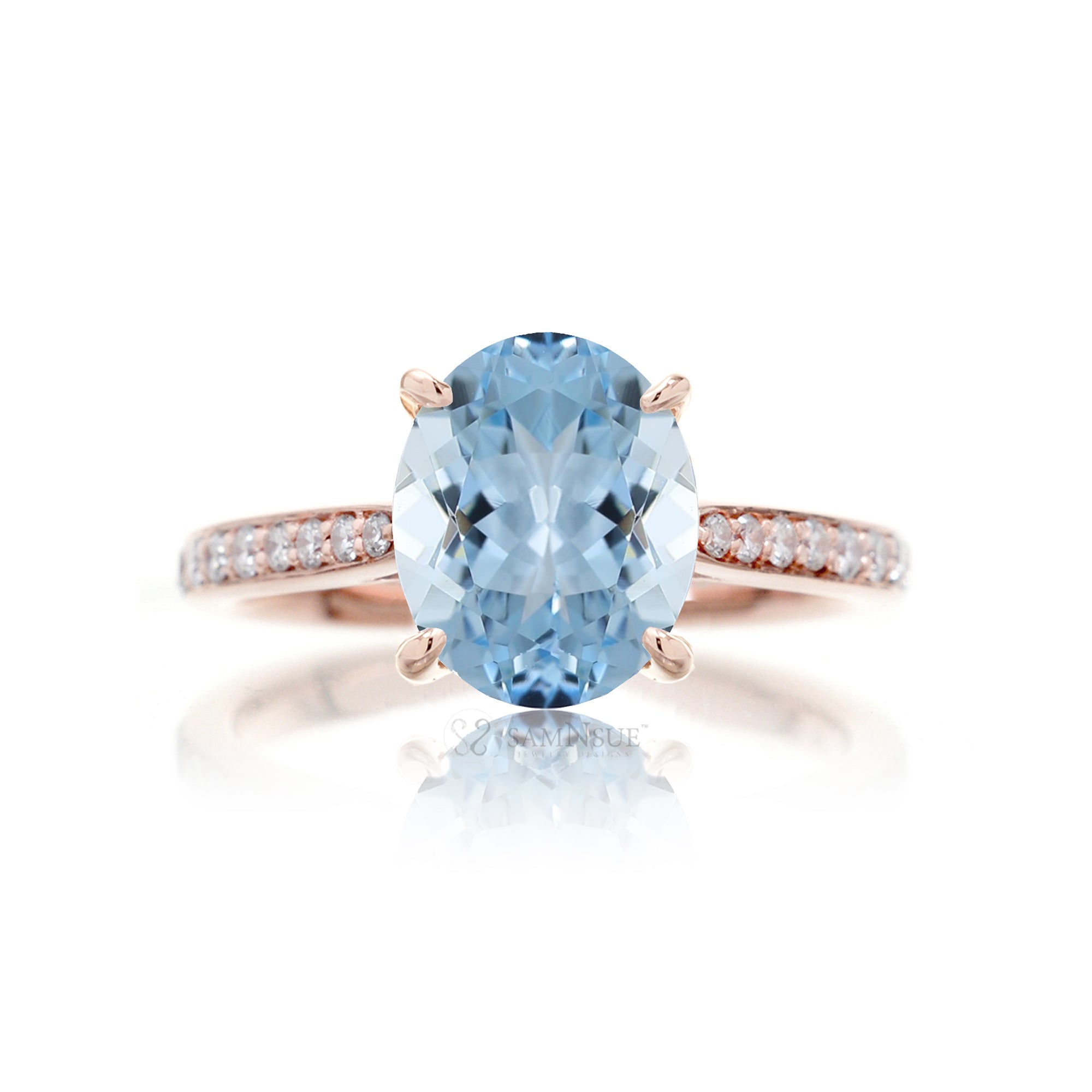 Oval cut aquamarine ring with a diamond band rose gold