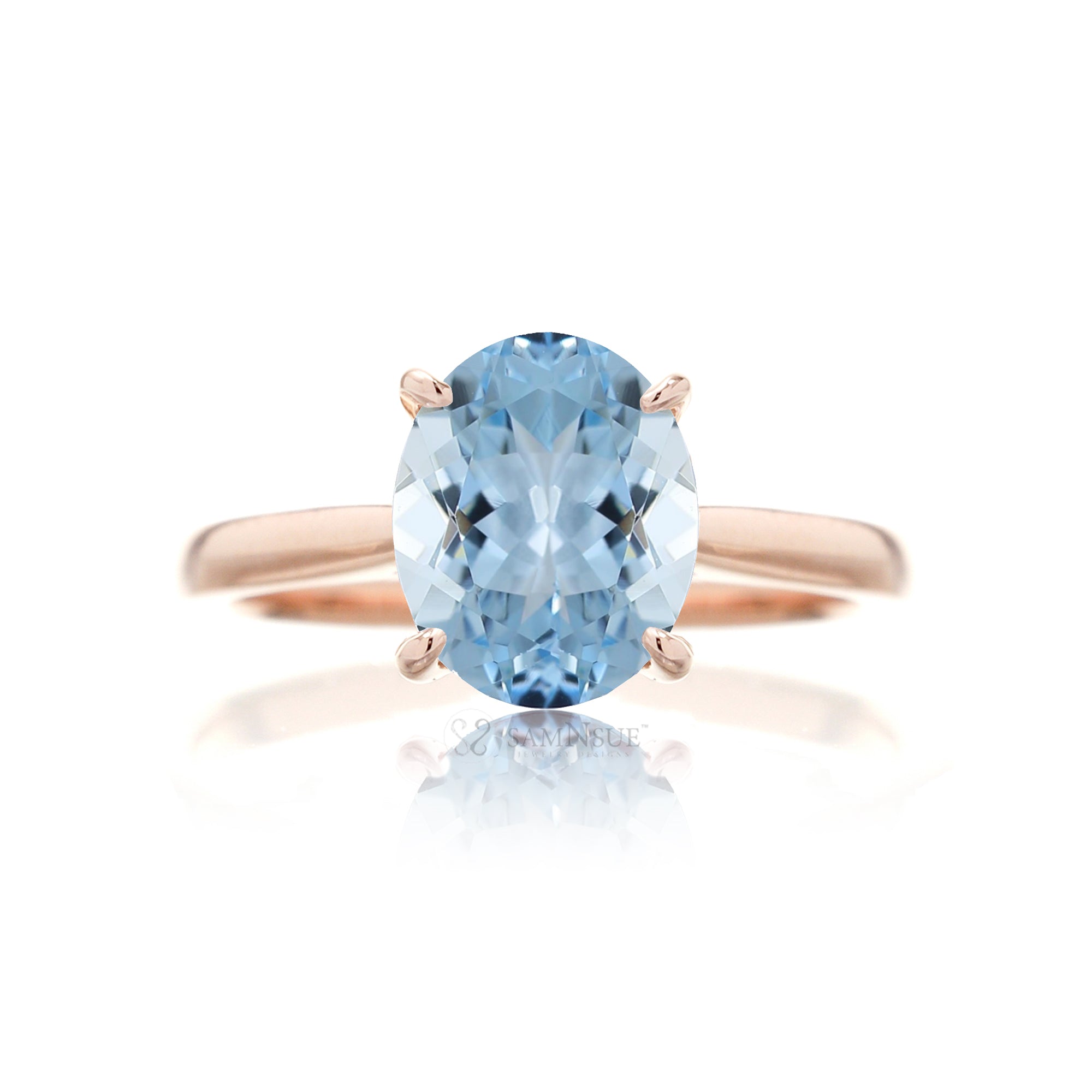 Oval cut aquamarine ring with a solid solitaire band rose gold