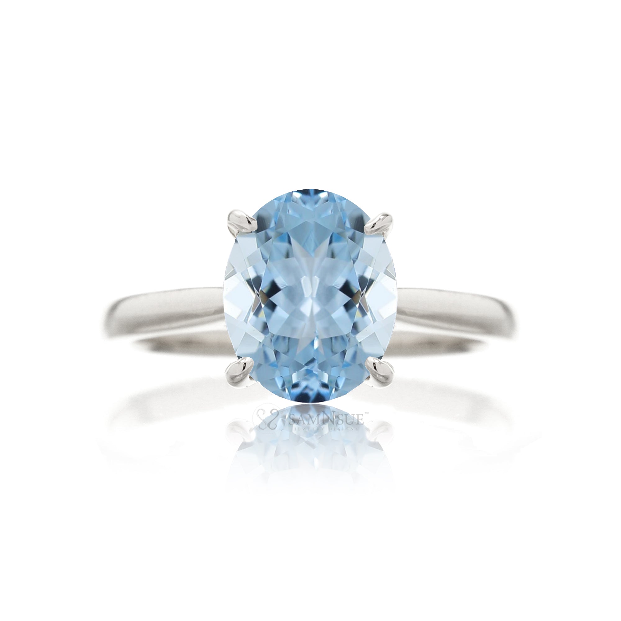 Oval cut aquamarine ring with a solid solitaire band white gold