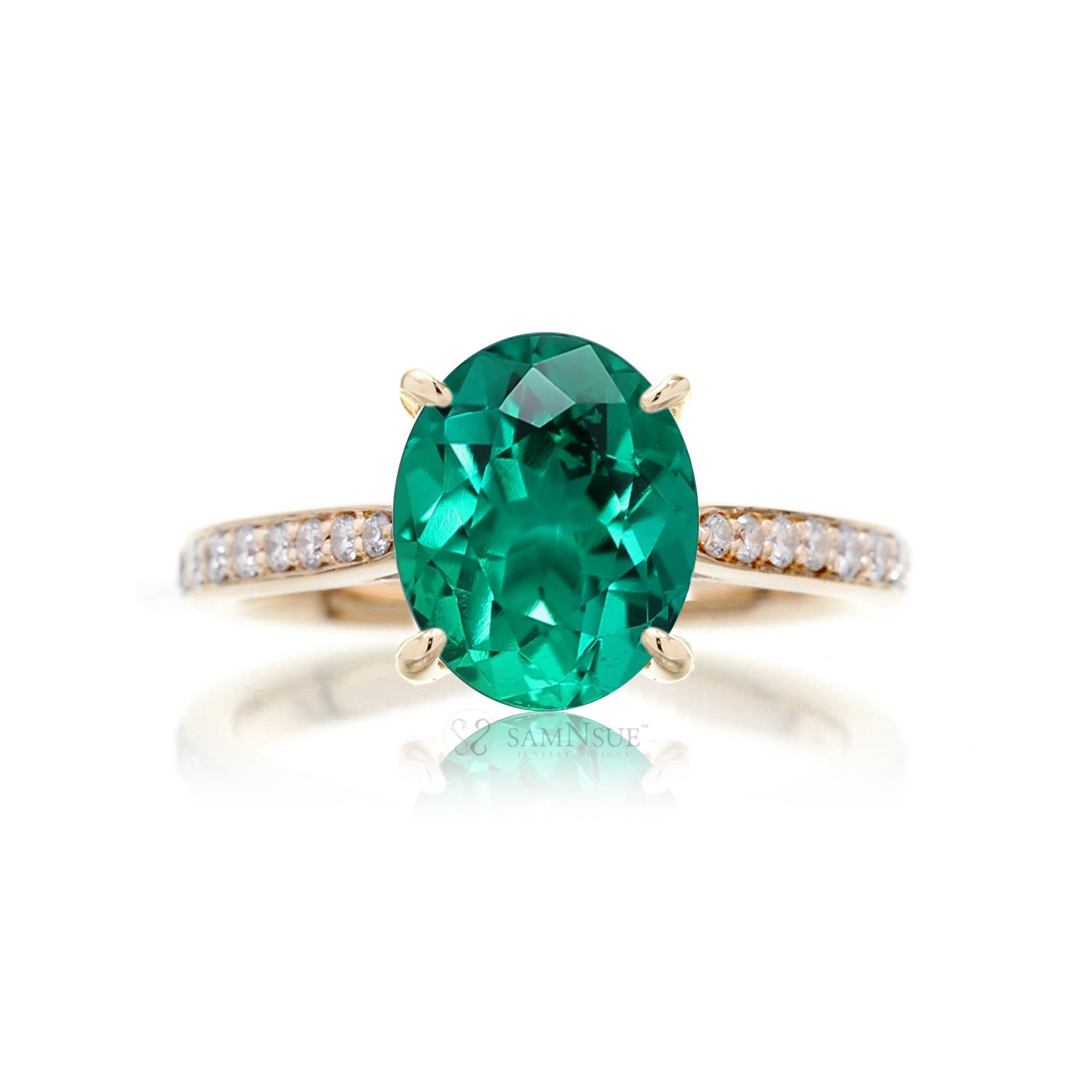 Oval cut emerald engagement ring with diamond hidden halo yellow gold