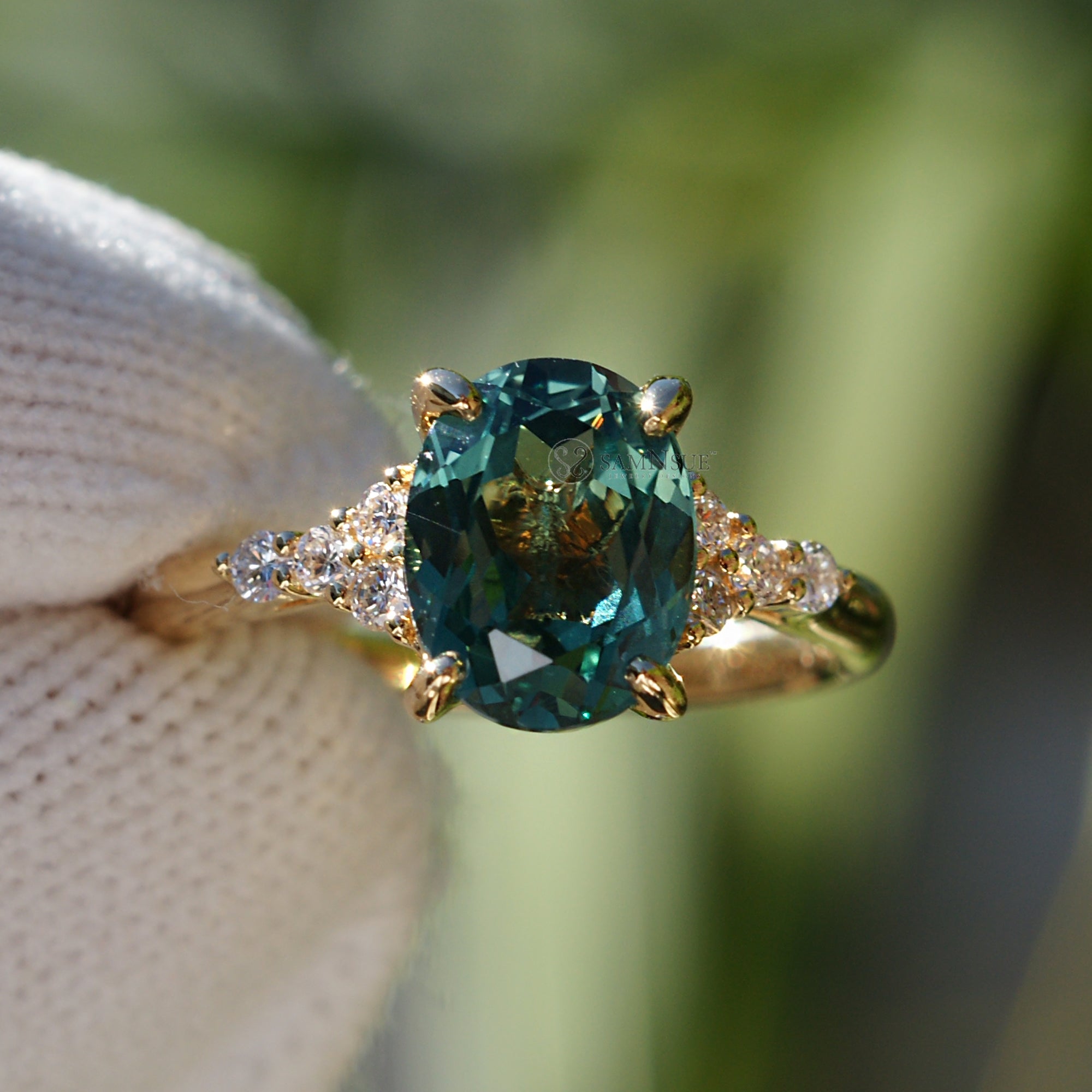 Oval cut green sapphire diamond three stone ring yellow gold