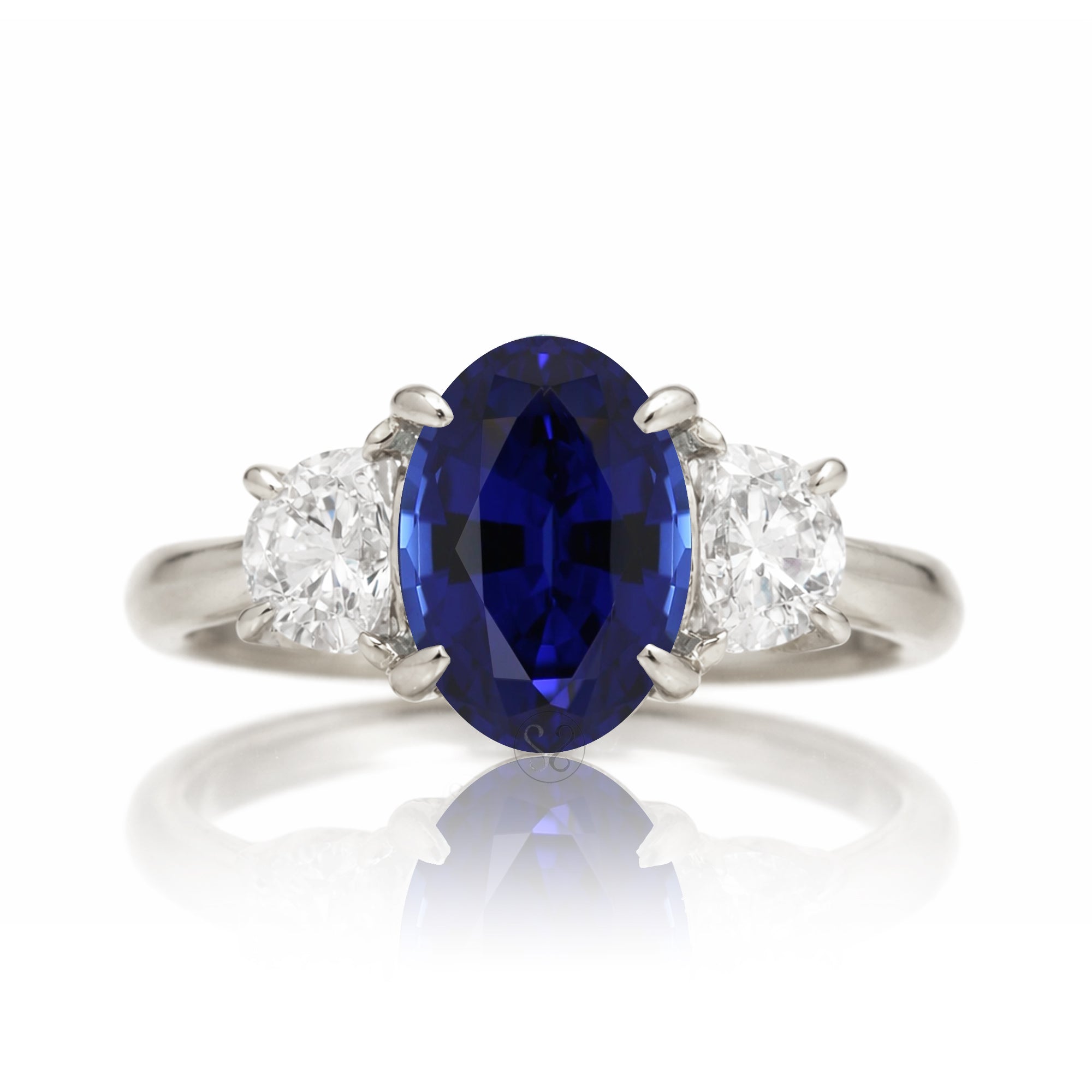Oval blue sapphire half moon diamond three stone ring white gold