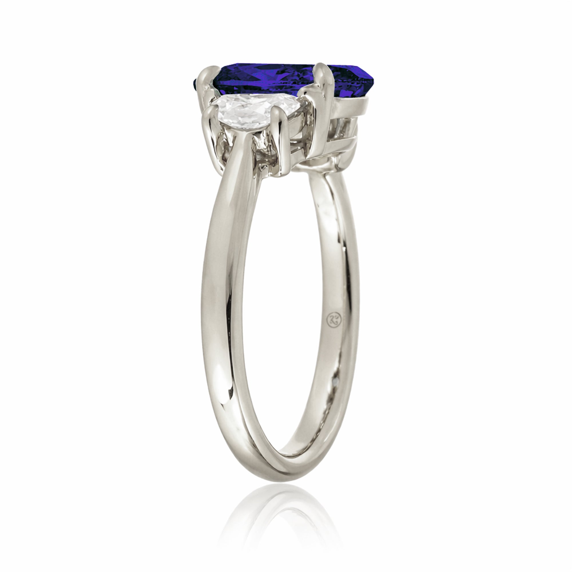 Oval blue sapphire half moon diamond three stone ring white gold
