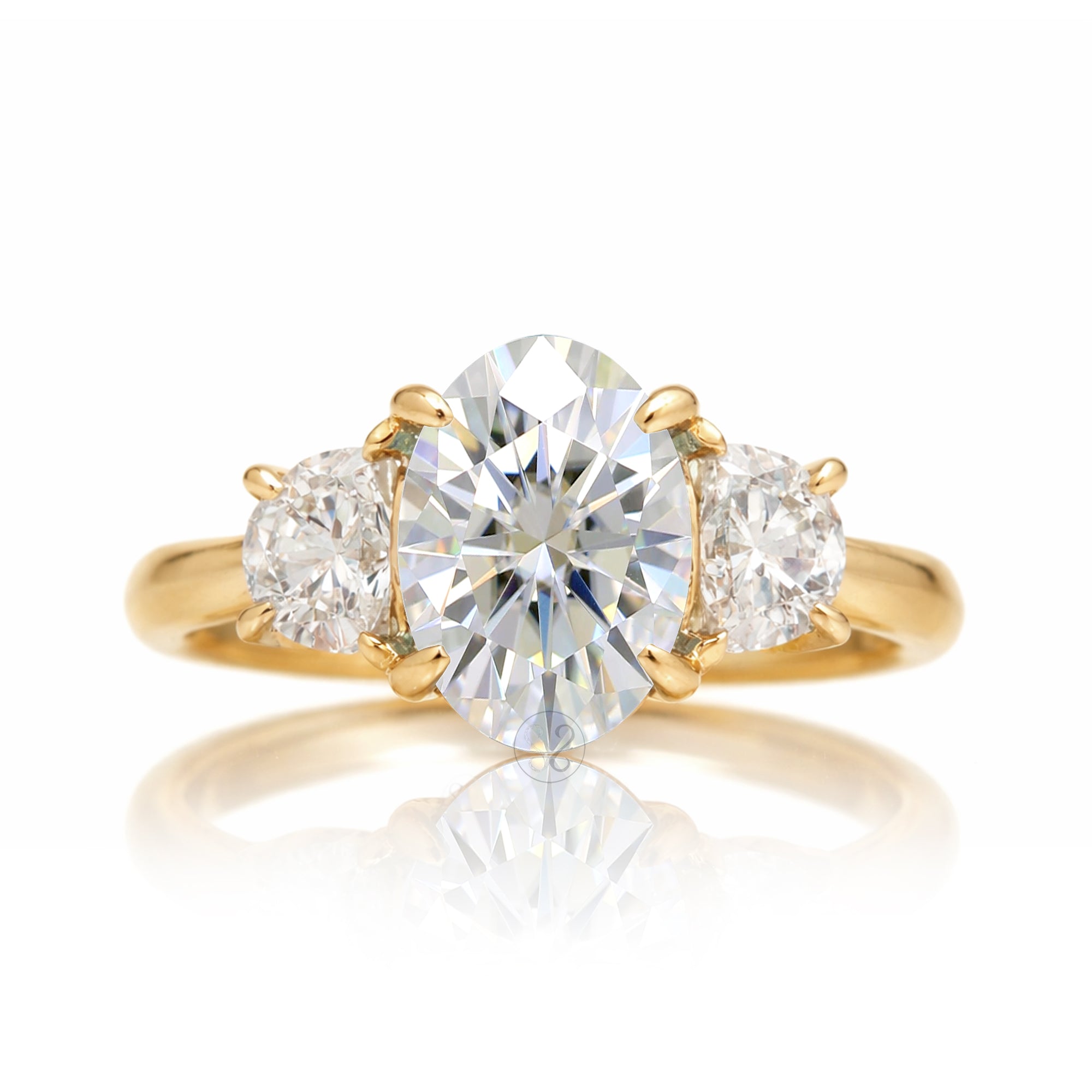 the-claire-three-stone-half-moon-oval-moissanite-ring-yellow-gold