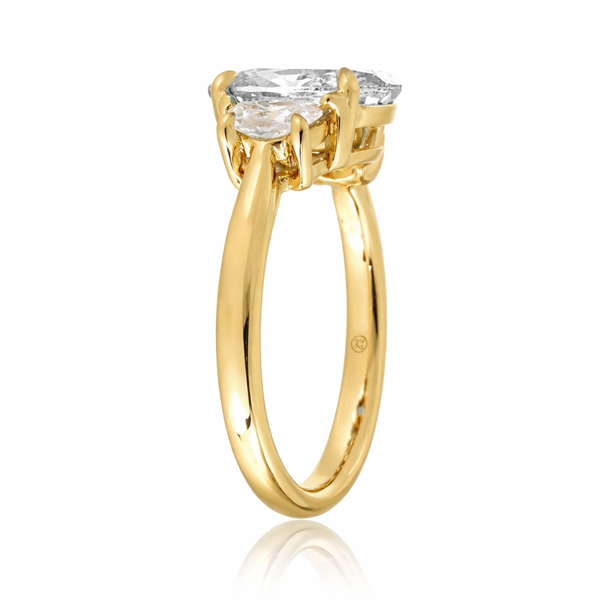 the-claire-three-stone-half-moon-oval-moissanite-ring-yellow-gold