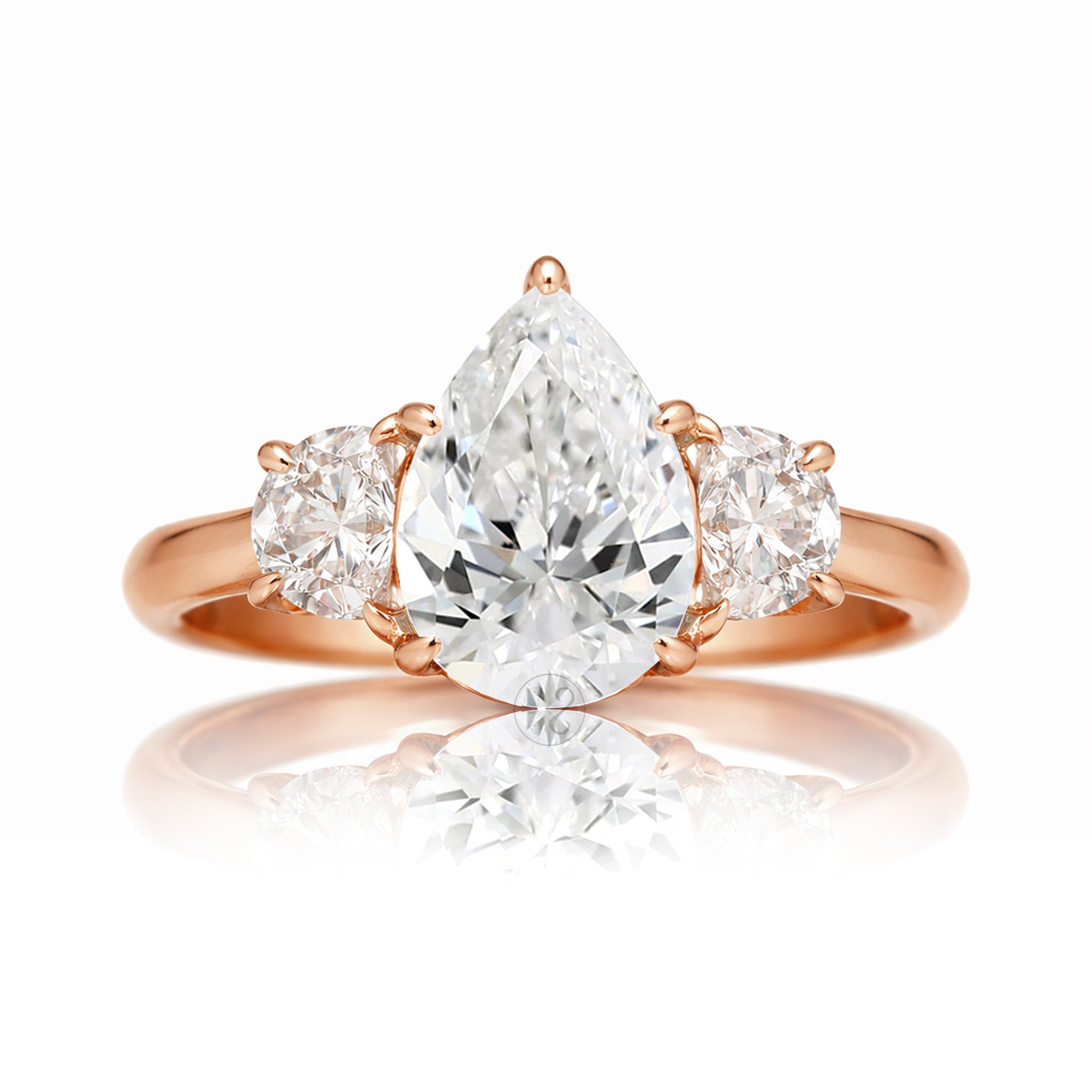 the-claire-three-stone-half-moon-pear-moissanite-ring-rose-gold