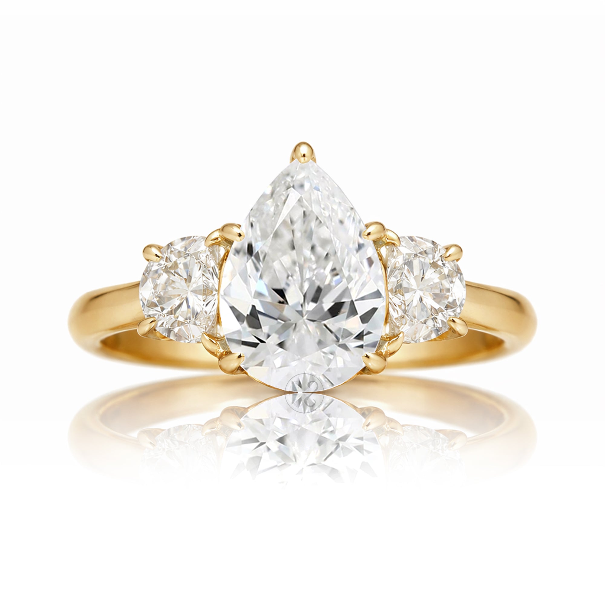 the-claire-three-stone-half-moon-pear-moissanite-ring-yellow-gold