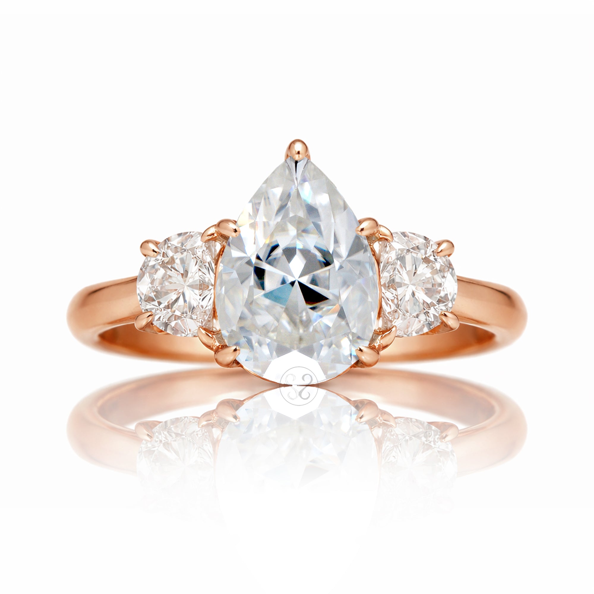 the-claire-three-stone-half-moon-pear-moissanite-ring-rose-gold