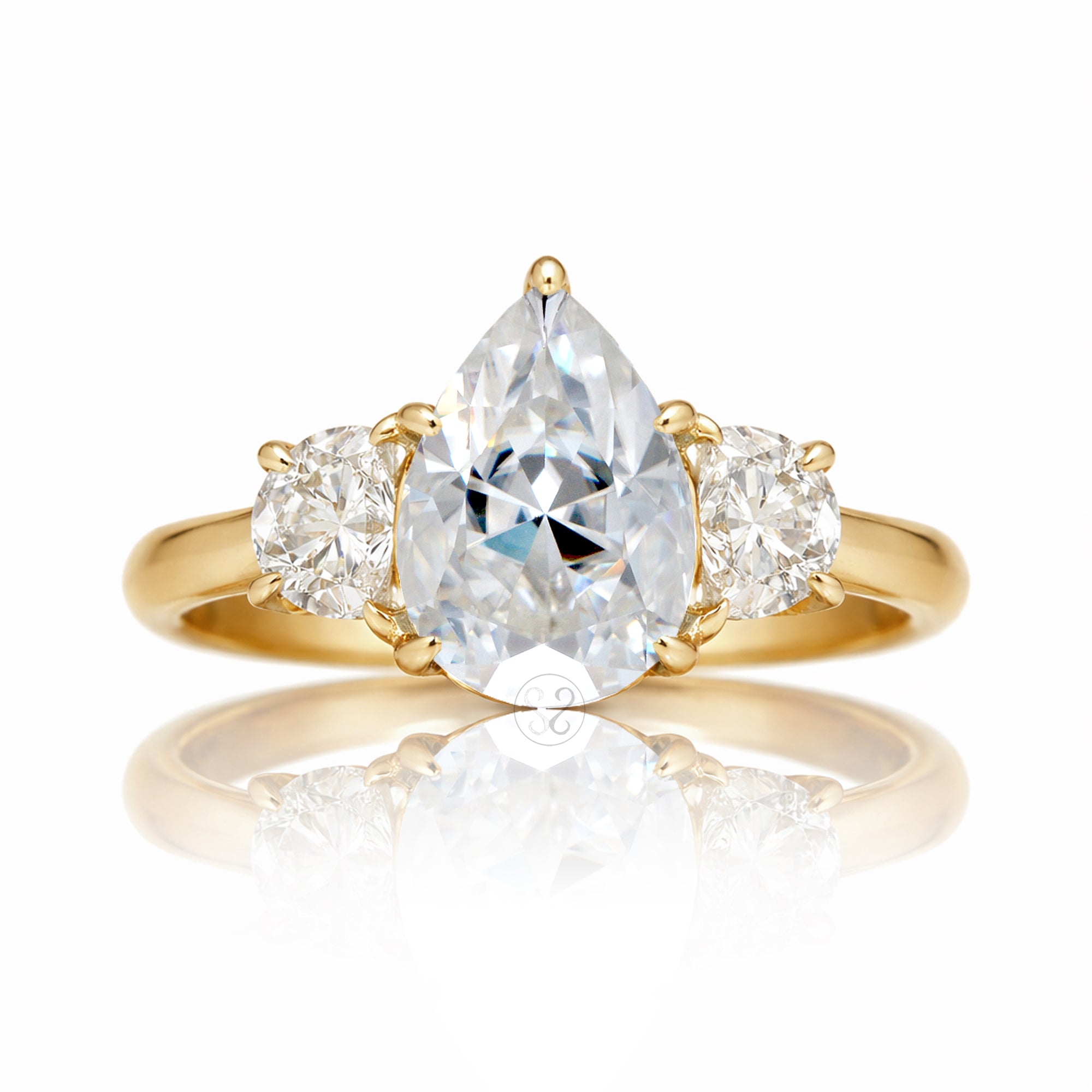 the-claire-three-stone-half-moon-pear-moissanite-ring-yellow-gold