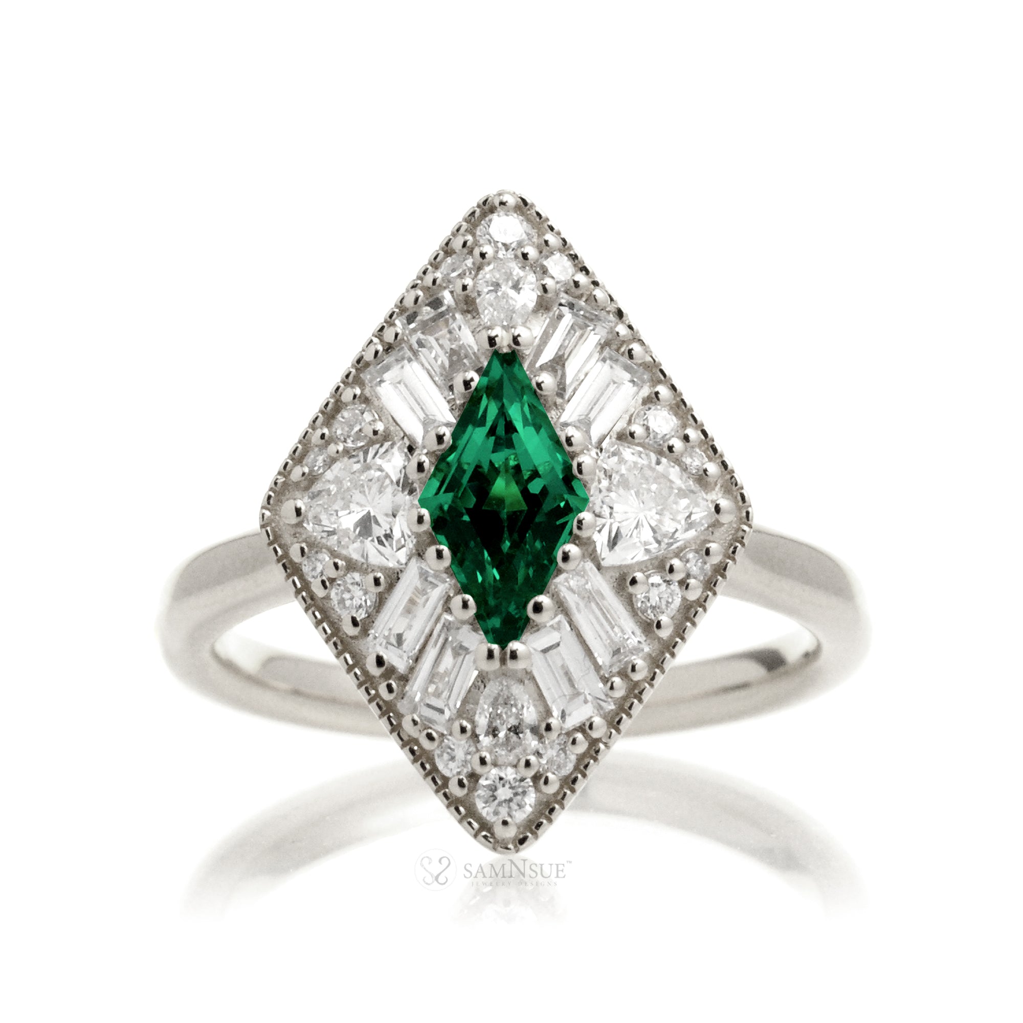 Kite cut green emerald and diamond vintage halo ring in white gold