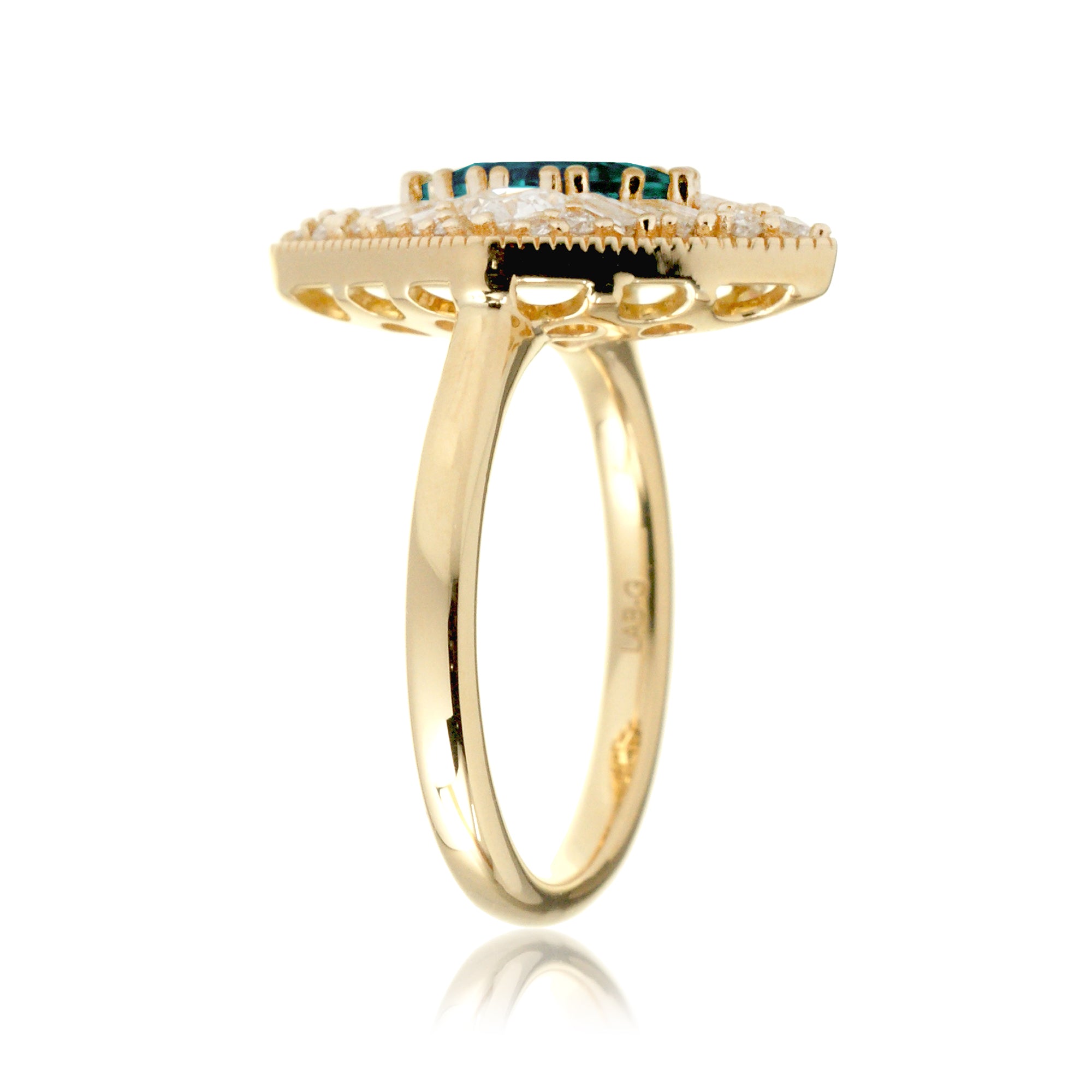 Kite cut green emerald and diamond vintage halo ring in yellow gold
