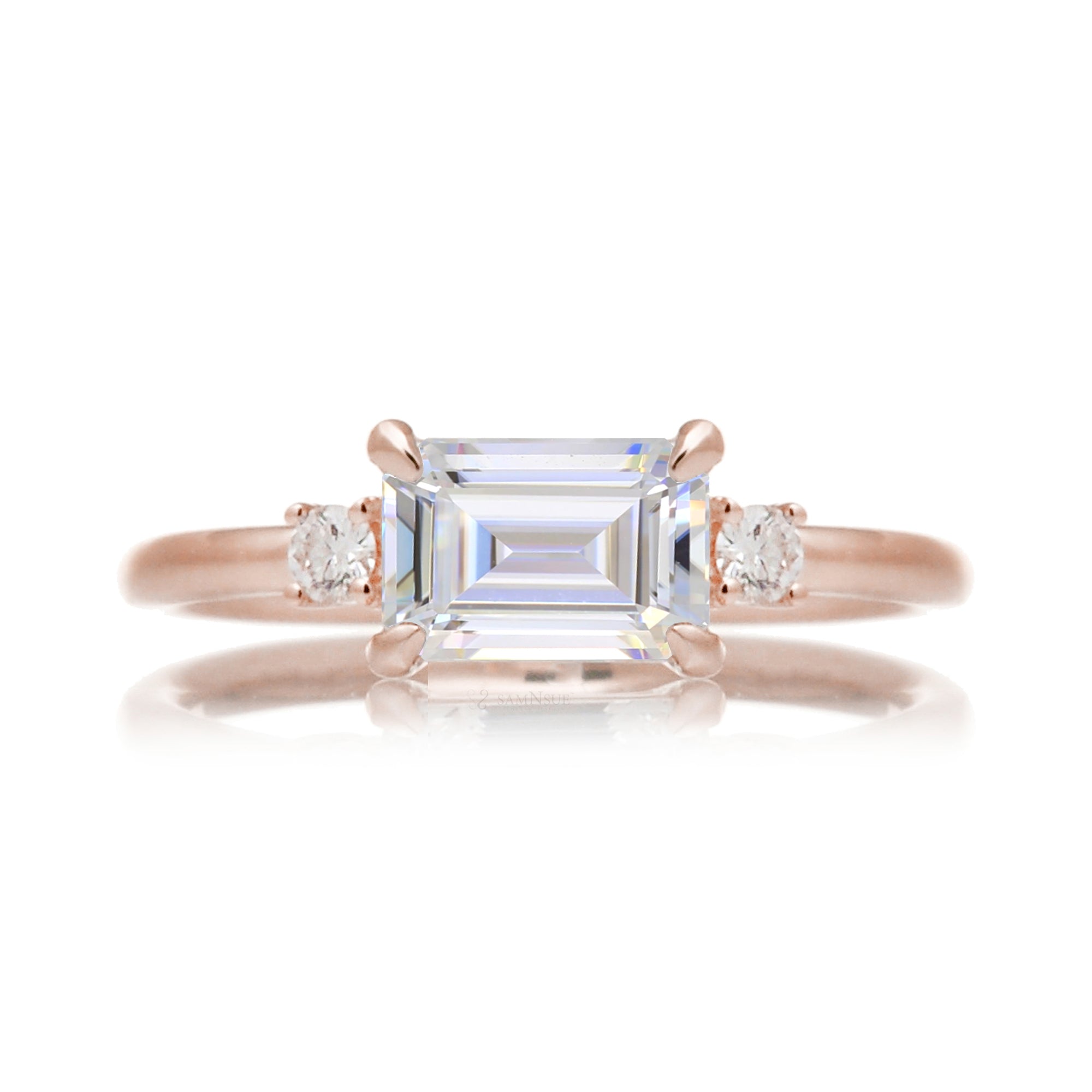 Emerald step cut moissanite three stone east-west ring the Lena rose gold