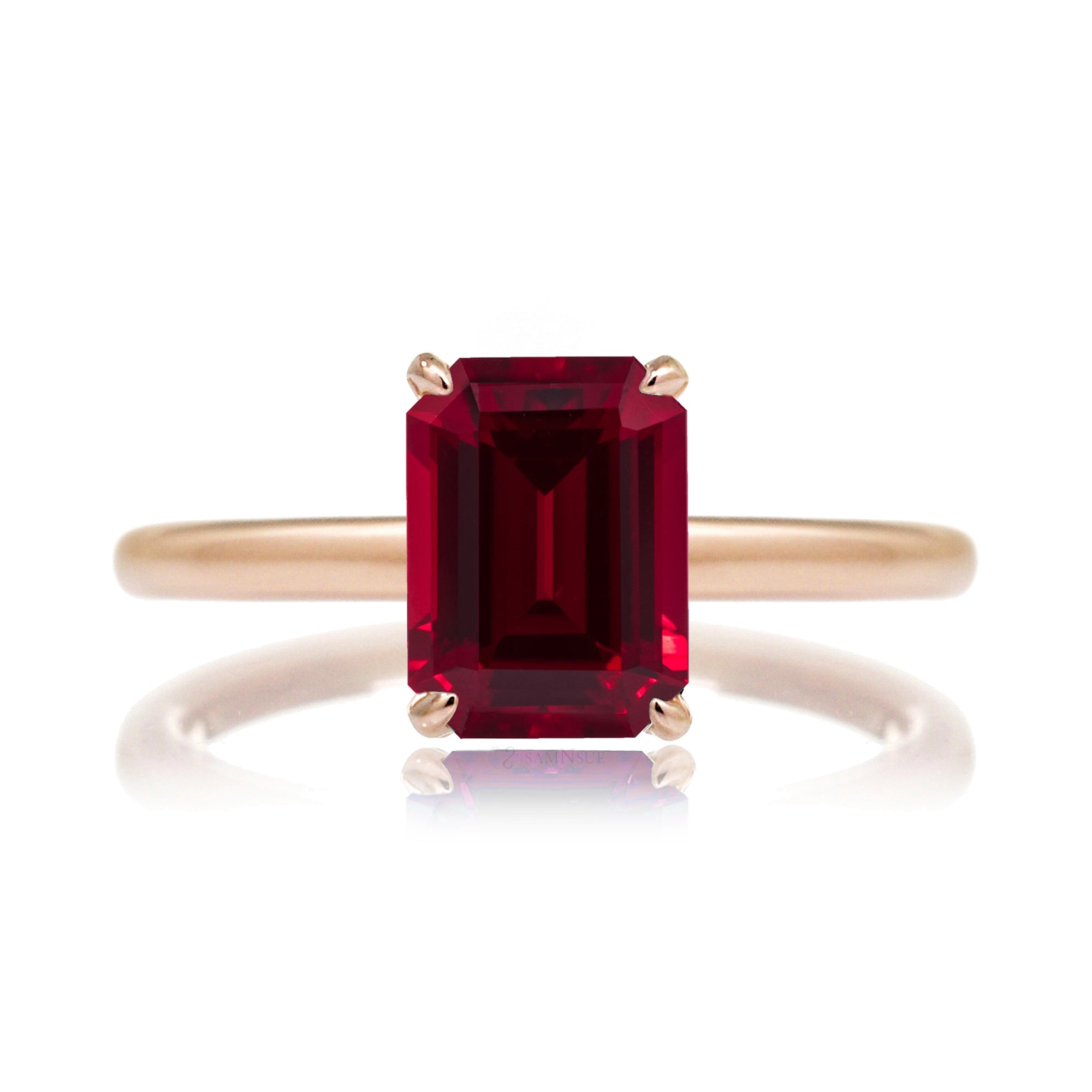 Emerald step cut ruby diamond hidden halo engagement ring in rose gold