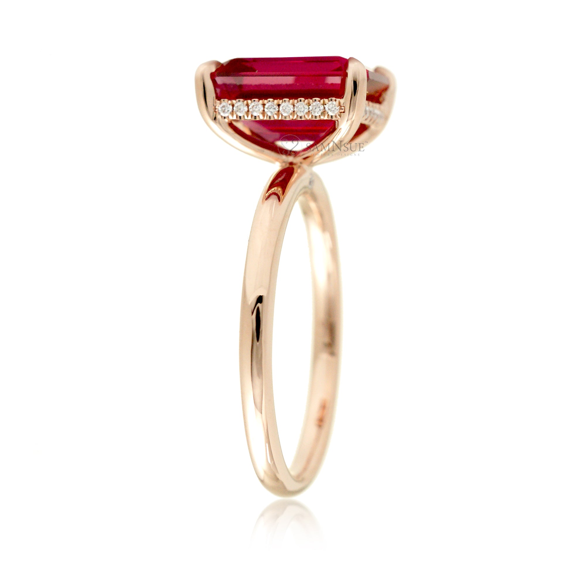 Emerald step cut ruby diamond hidden halo engagement ring in rose gold