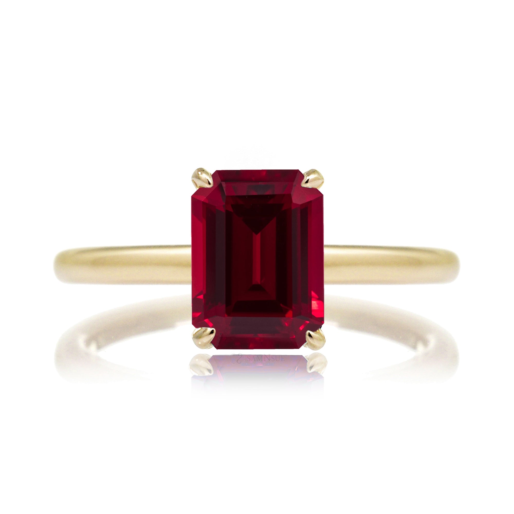Emerald step cut ruby diamond hidden halo engagement ring in yellow gold
