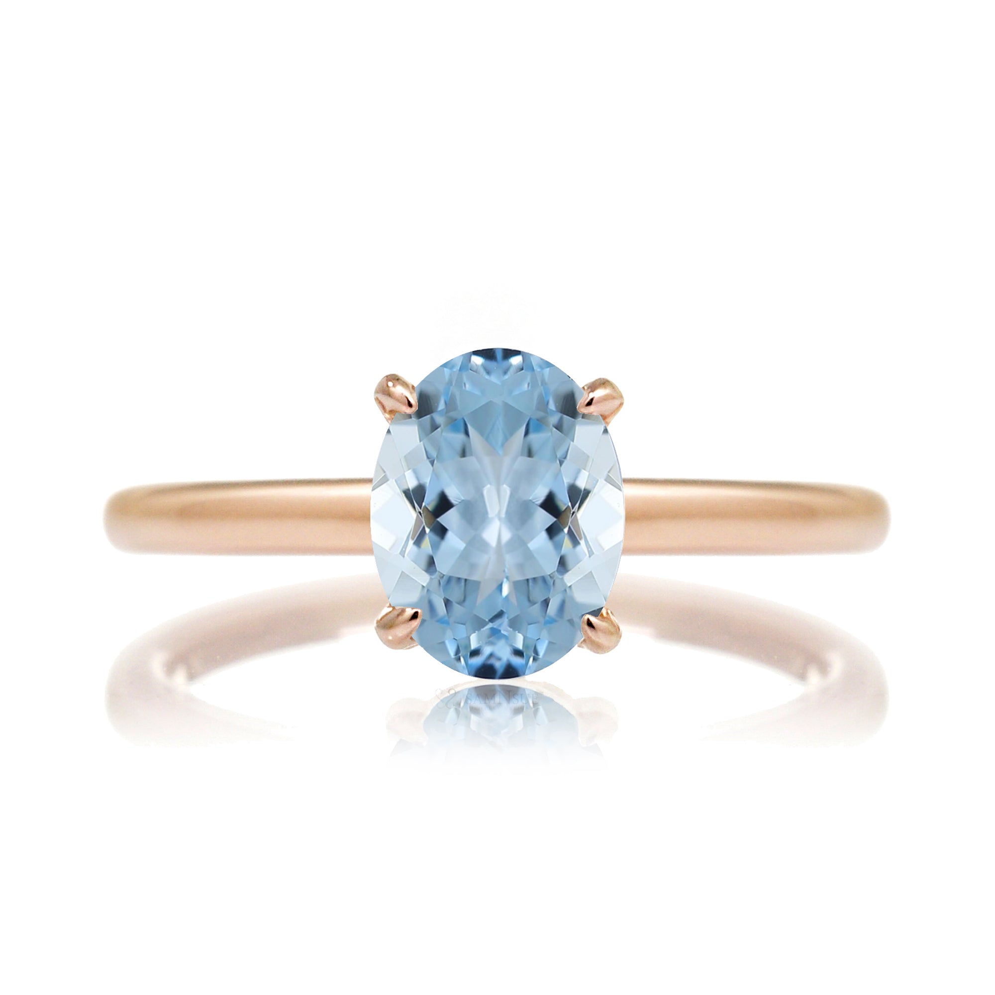 Oval aquamarine ring with diamond hidden halo and rounded band rose gold