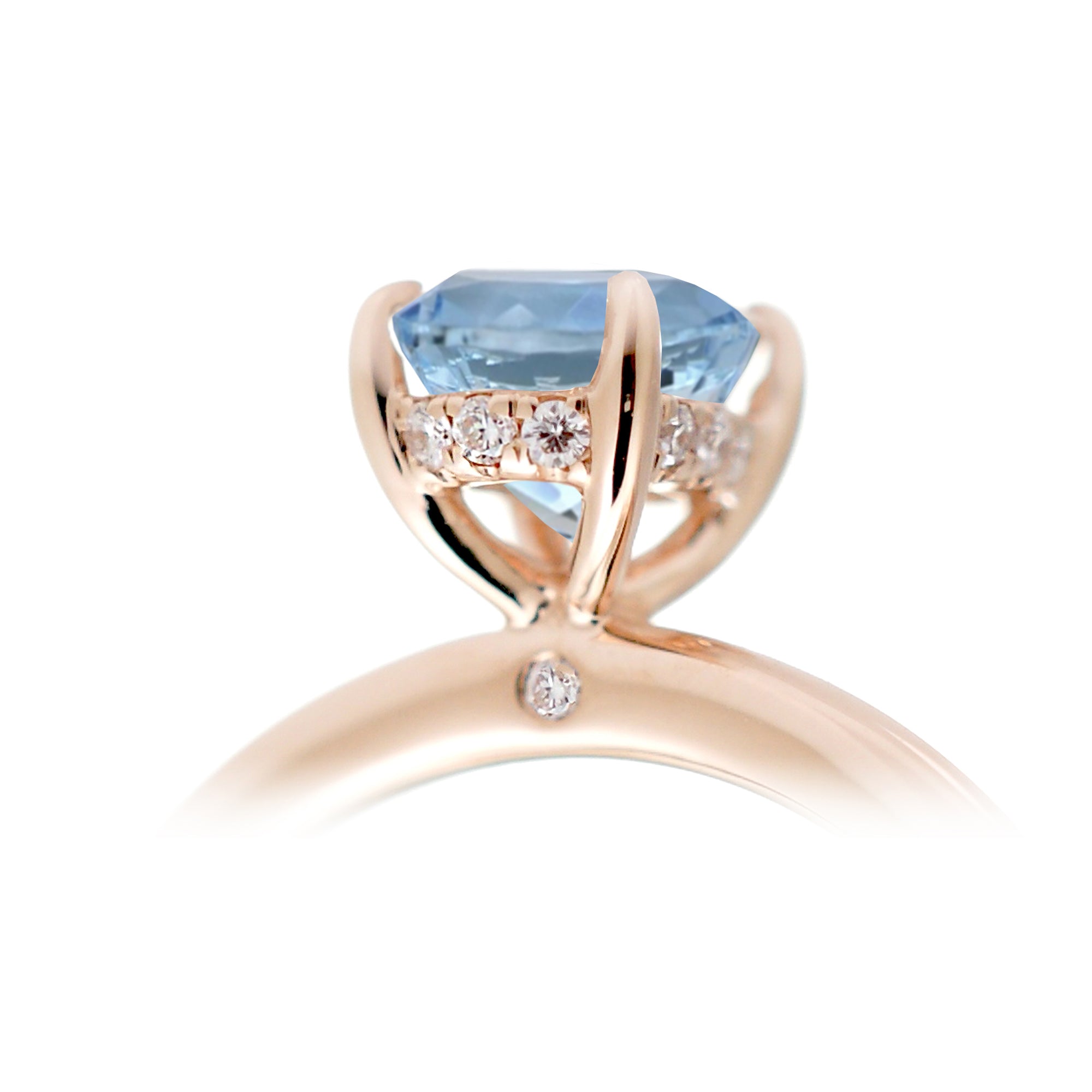 Oval aquamarine ring with diamond hidden halo and rounded band rose gold