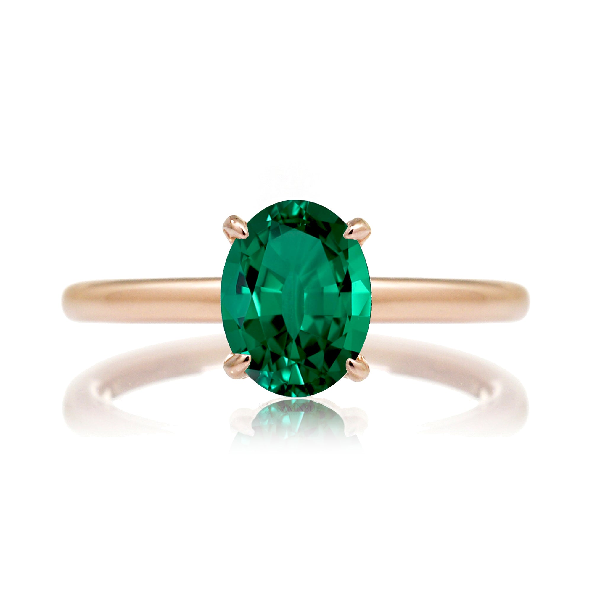 Oval cut green emerald ring with diamond hidden halo on rose gold