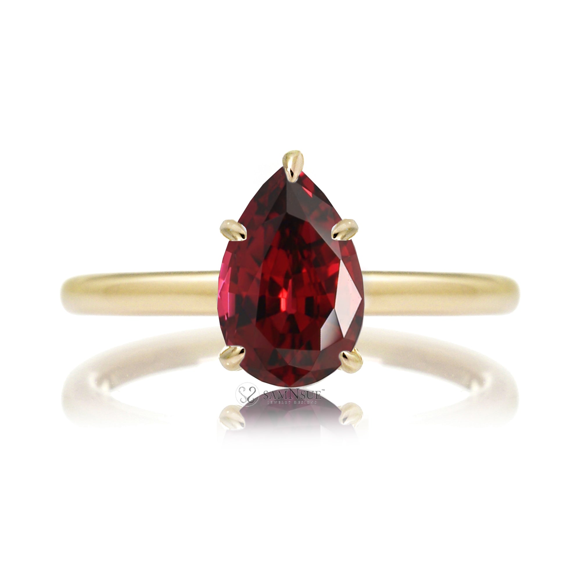 Pear ruby solitaire engagement ring in yellow gold with hidden halo