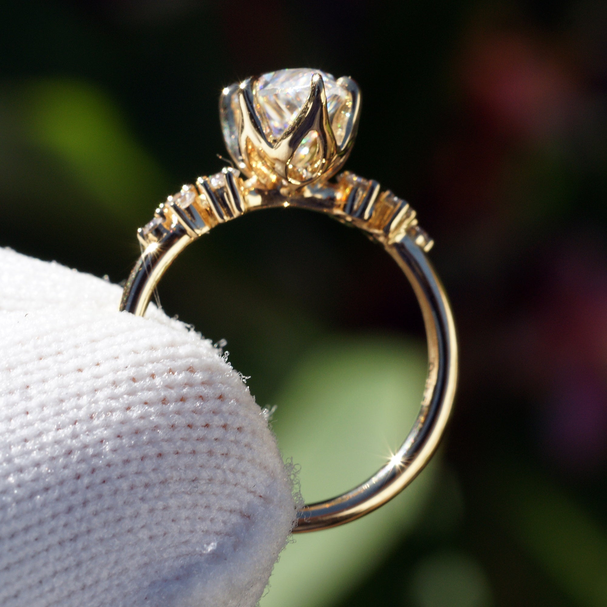 Marquise cut moissanite and diamond engagement ring in the stella yellow gold side view