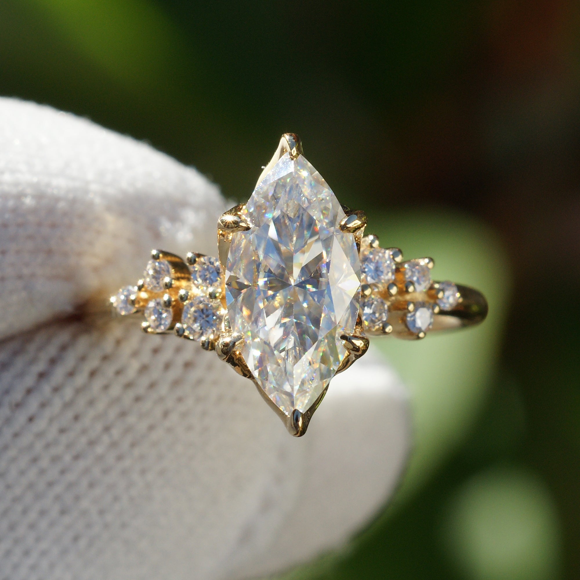 Marquise cut moissanite and diamond engagement ring in the stella yellow gold top view