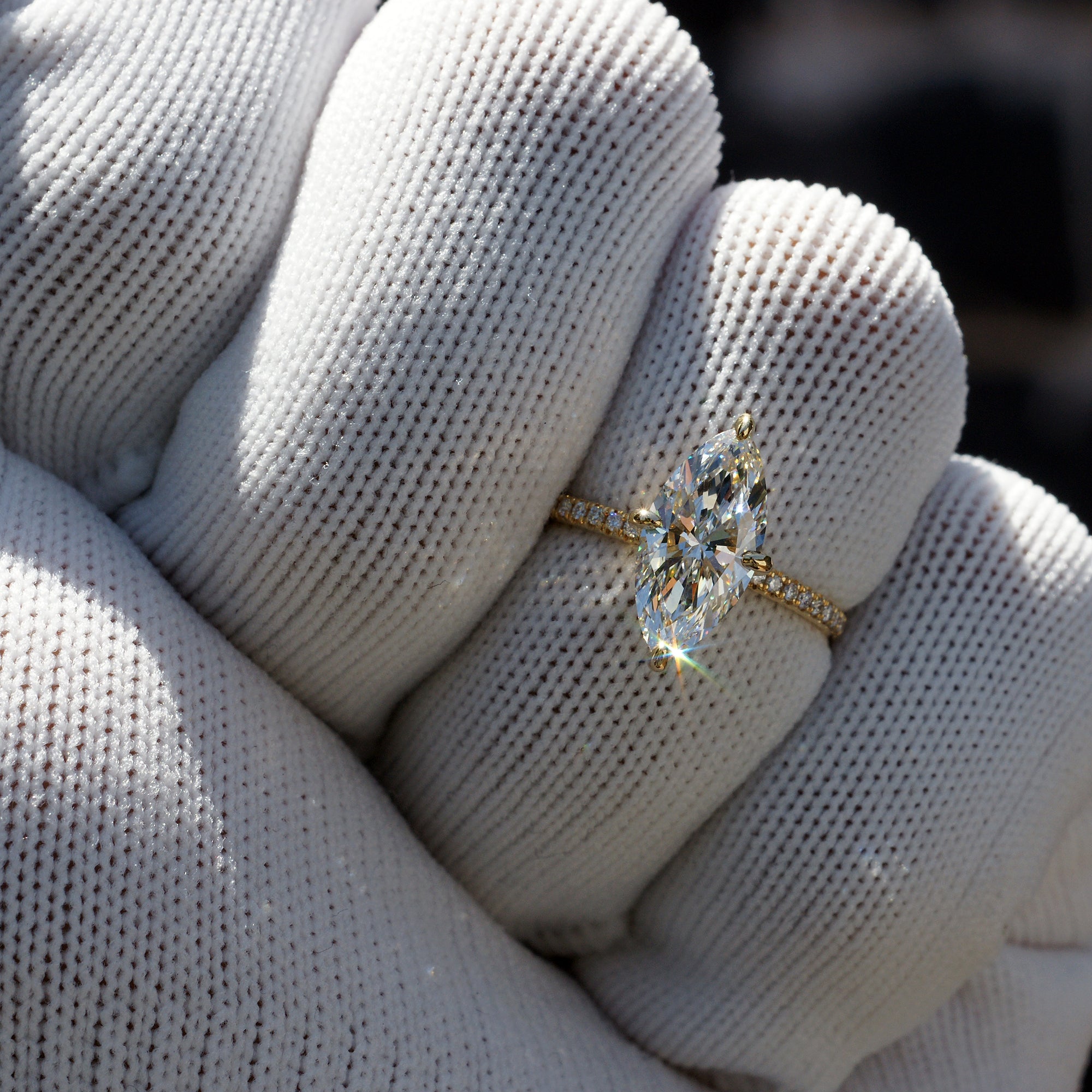 Marquise diamond engagement ring in yellow gold north east south west prongs
