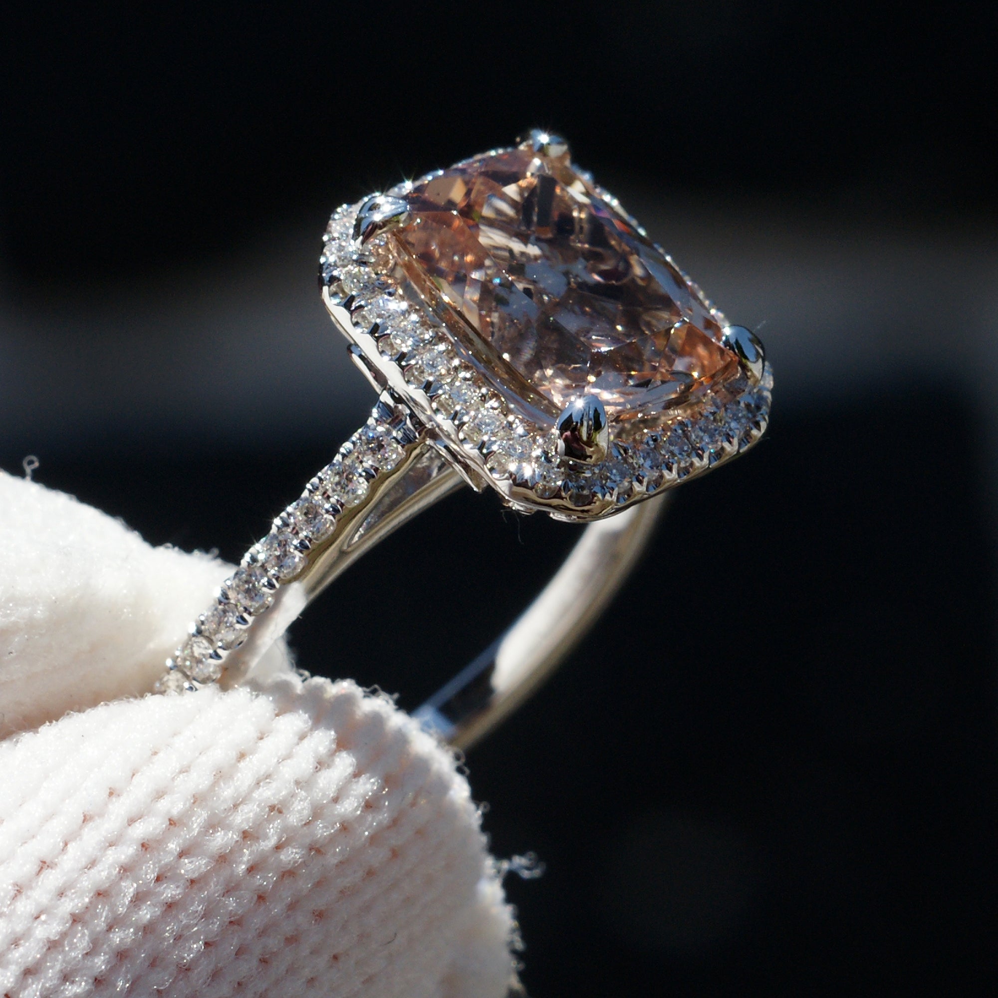 Cushion morganite engagement ring in white gold with diamond halo and band