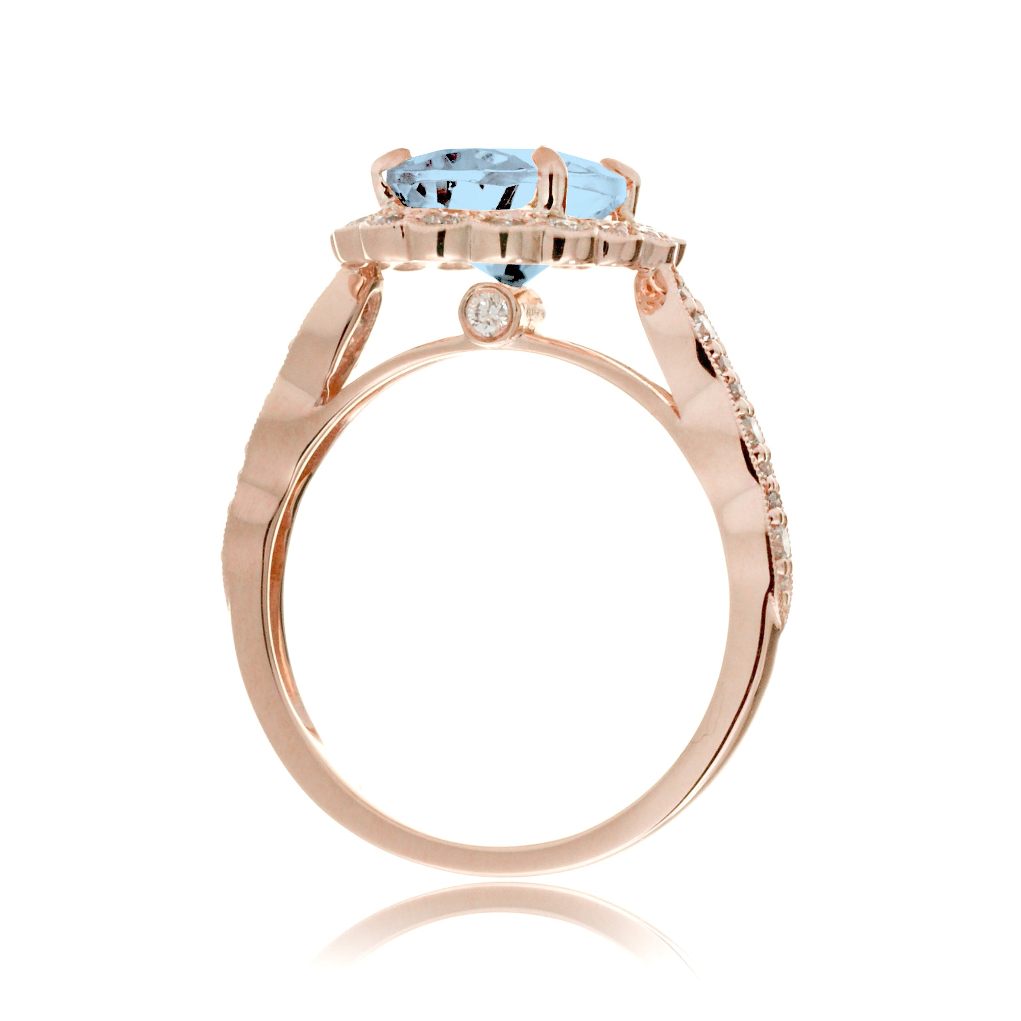 Oval aquamarine ring with diamond scallop halo and vintage diamond band in rose gold