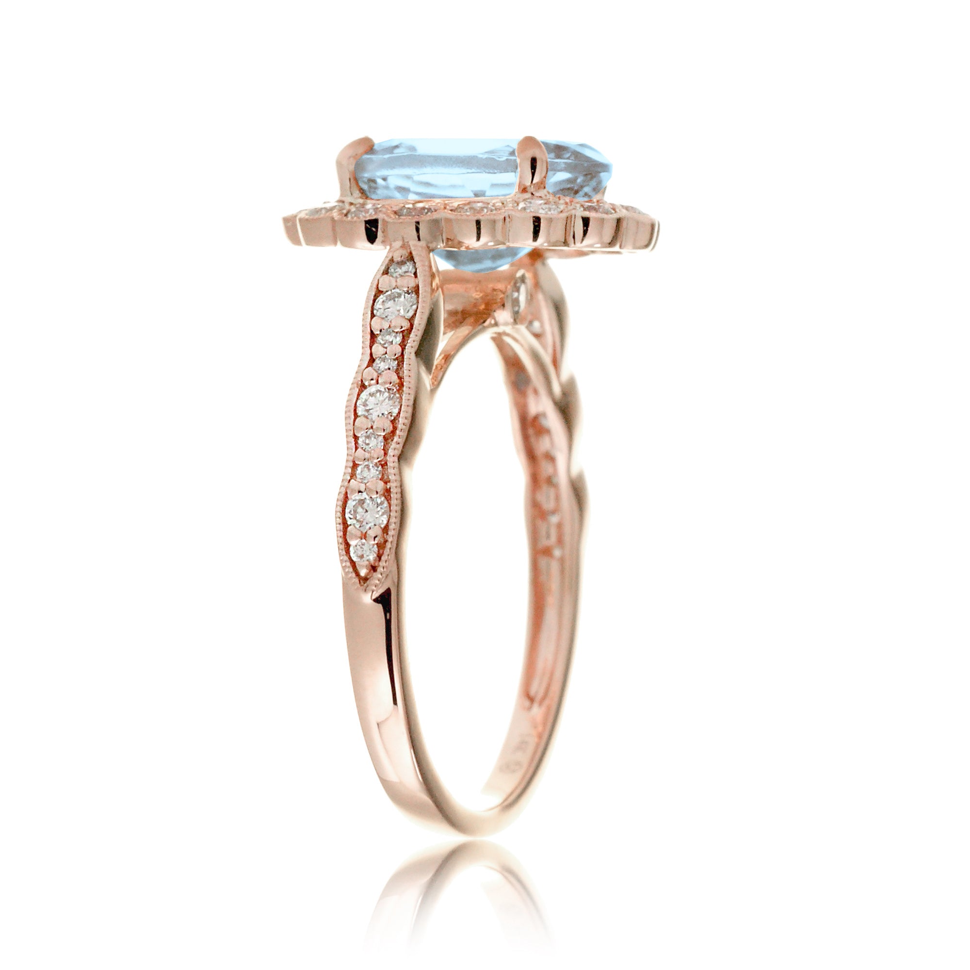 Oval aquamarine ring with diamond scallop halo and vintage diamond band in rose gold