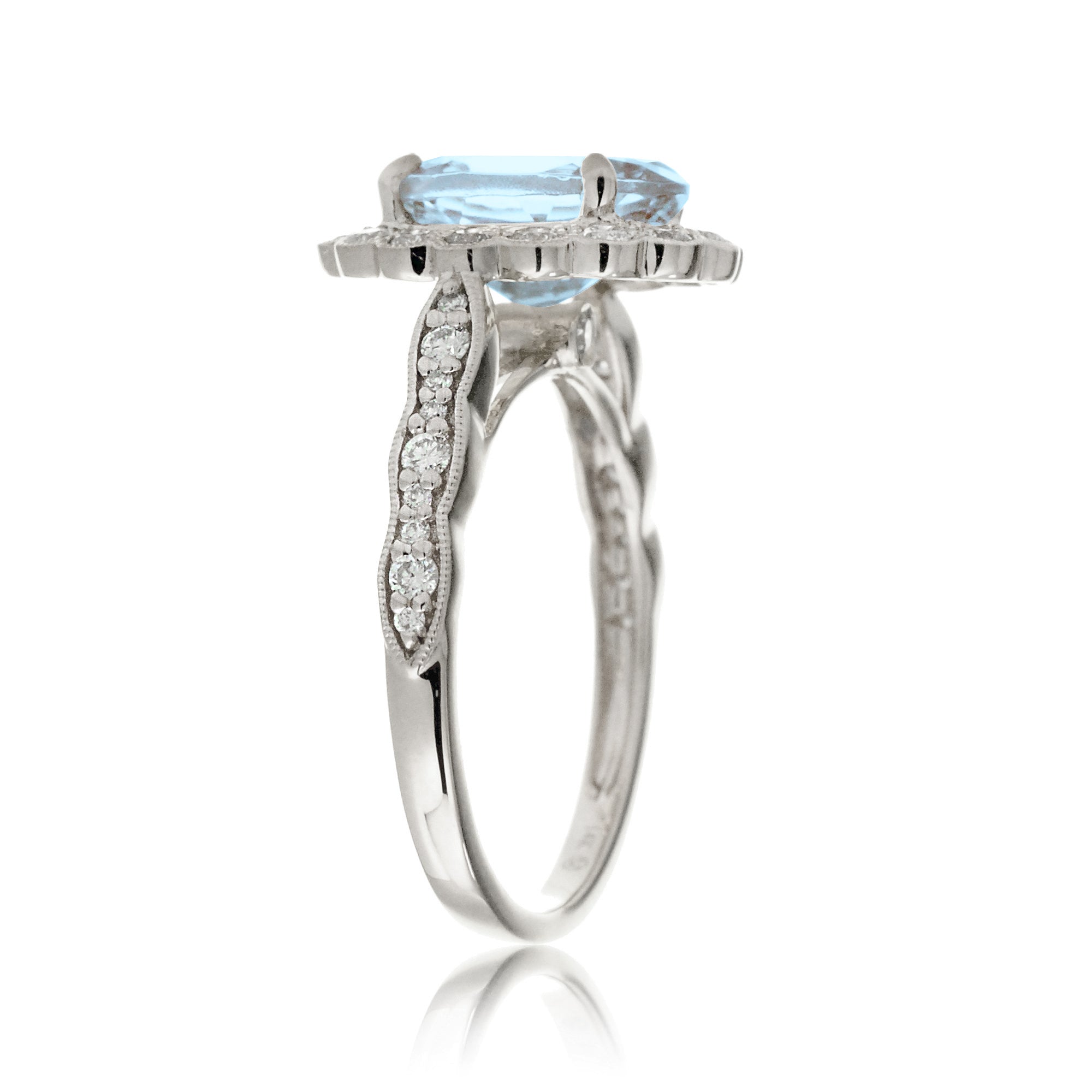 Oval aquamarine ring with diamond scallop halo and vintage diamond band in white gold