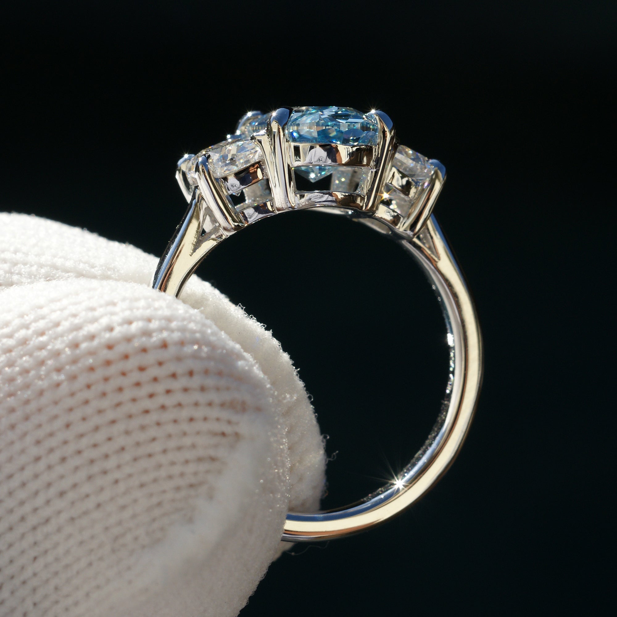 Oval blue diamond three stone half moon ring in platinum