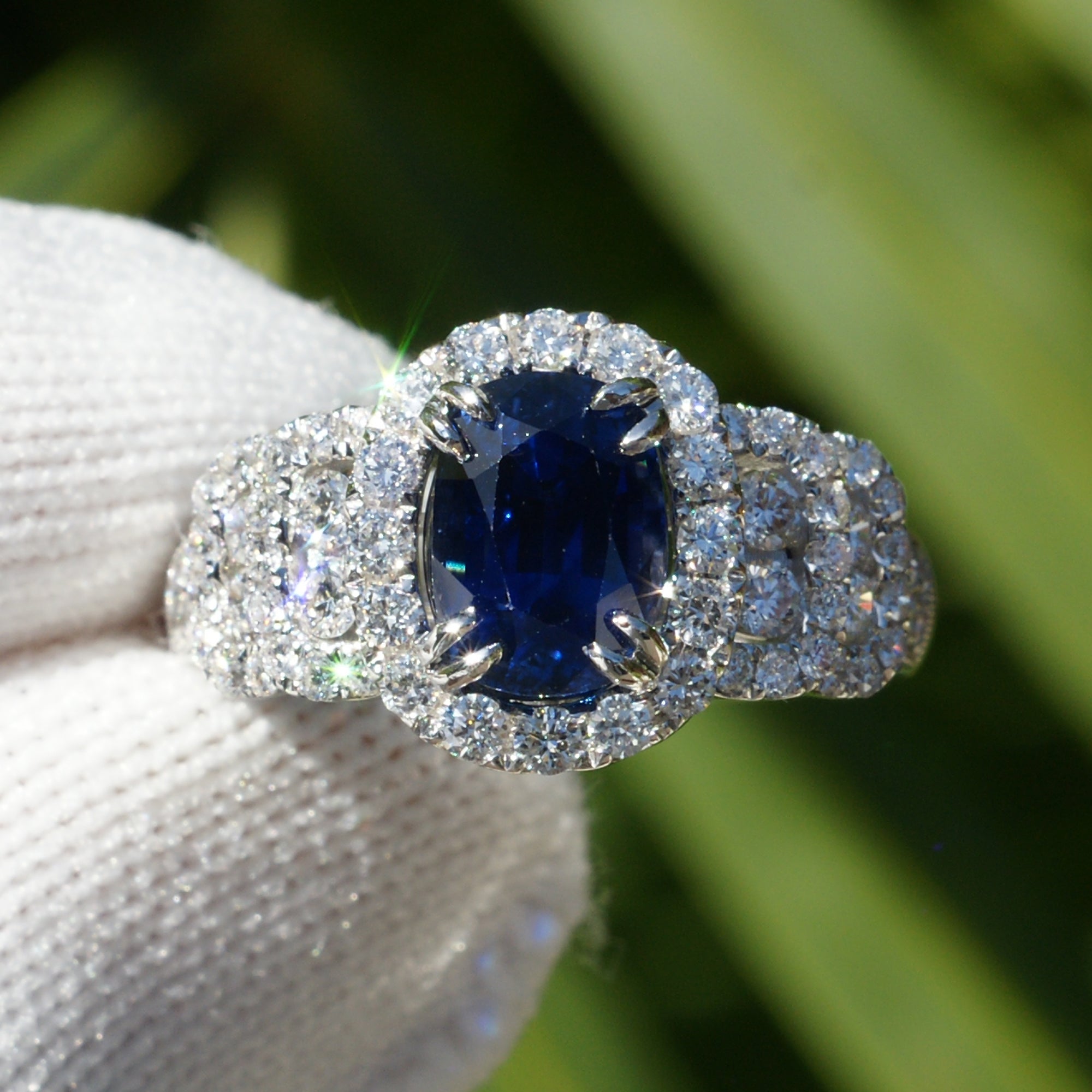 Natural sapphire and diamond ring with halo and wide band in white gold