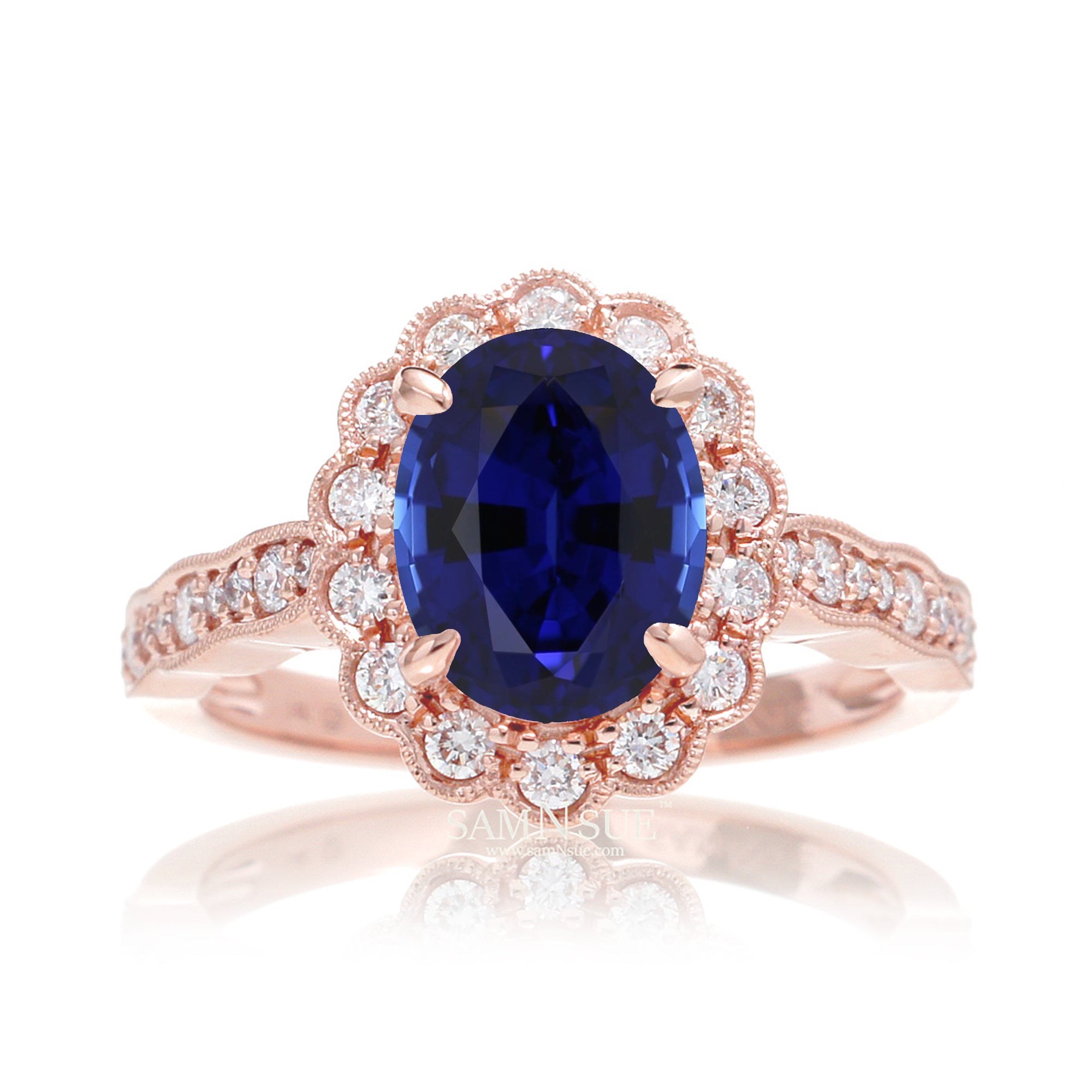 Blue oval sapphire ring with diamond halo in a vintage scallop design rose gold