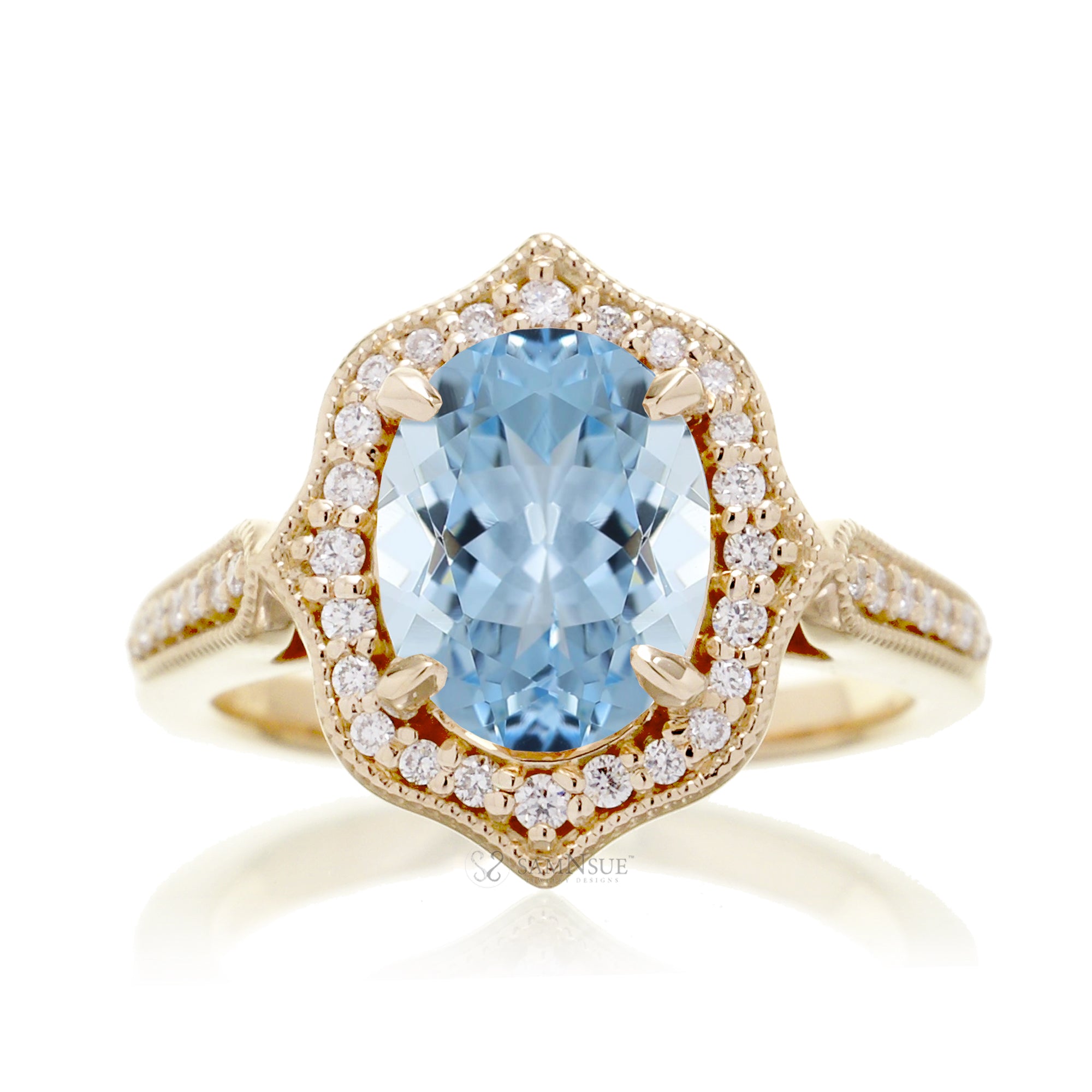 Vintage Oval Aquamarine and Diamond Halo Ring in Yellow Gold