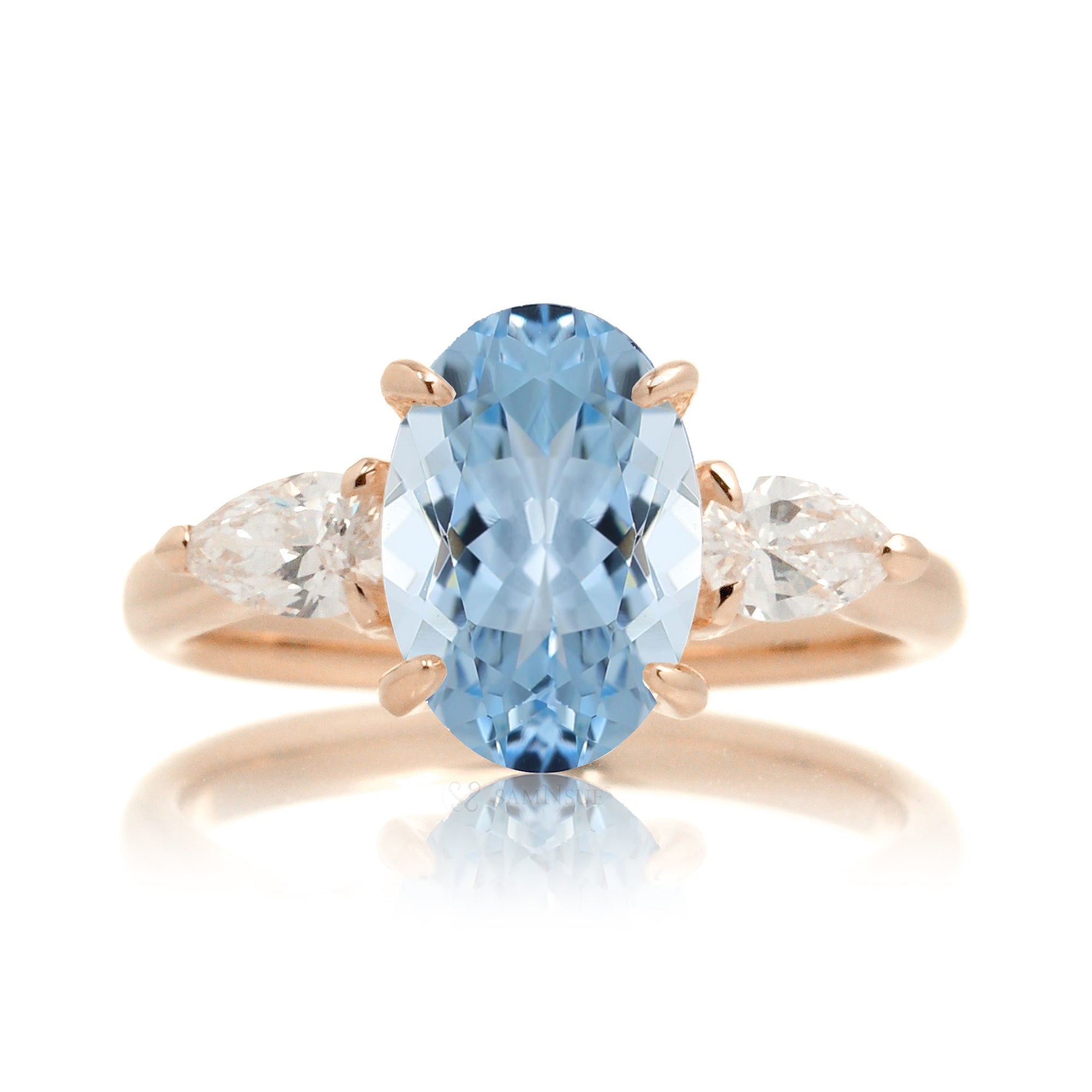 Oval aquamarine proposal ring with pear side diamonds rose gold