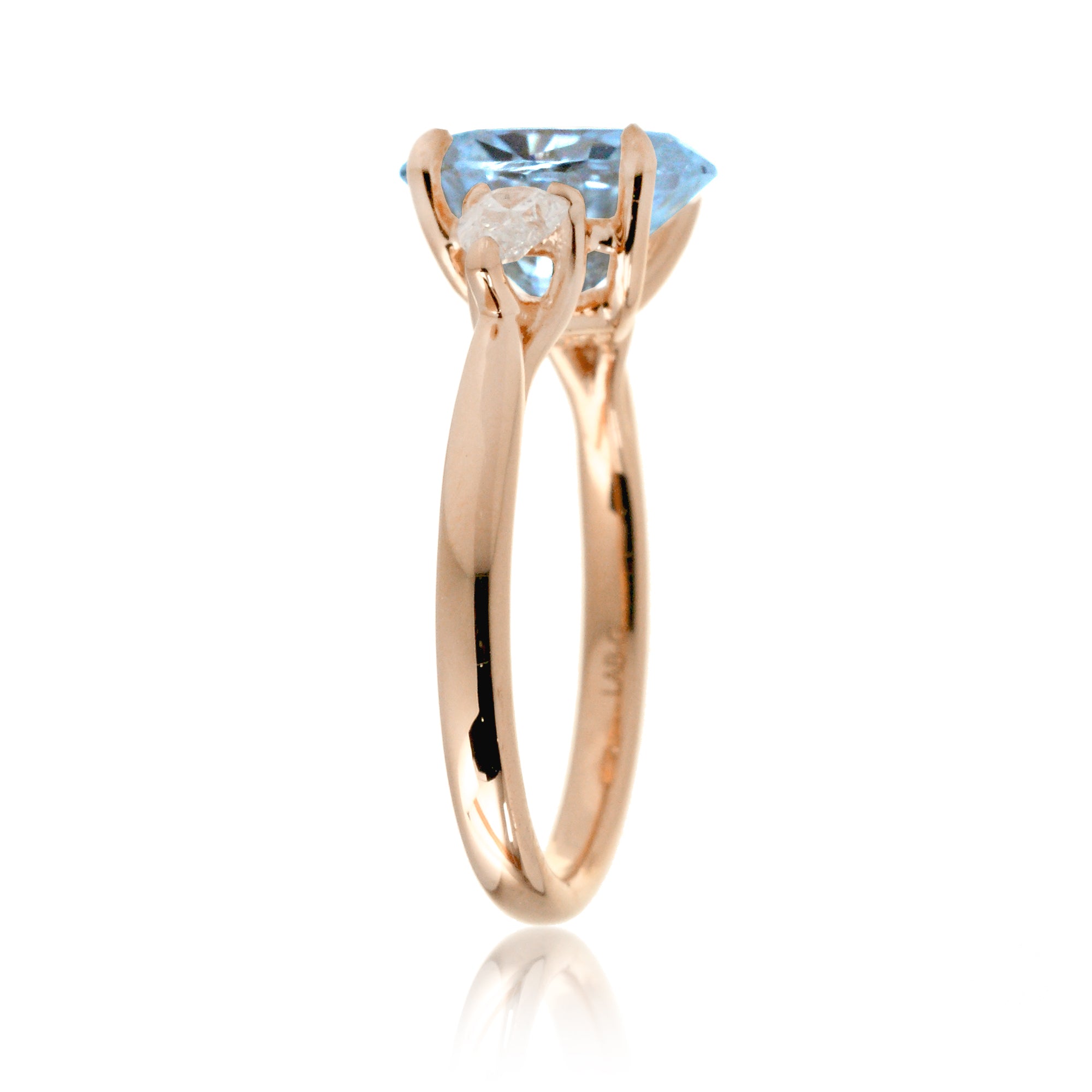 Oval aquamarine proposal ring with pear side diamonds rose gold