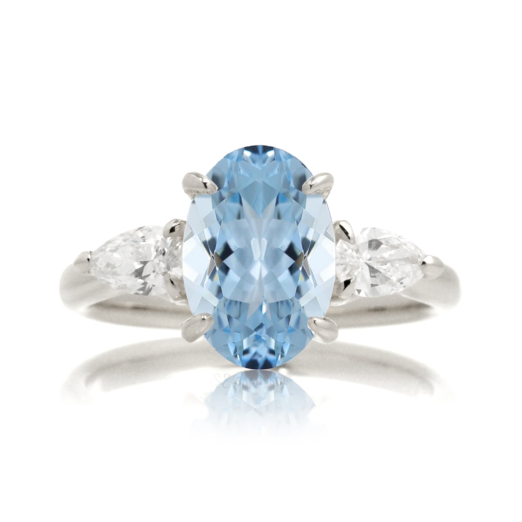 Oval aquamarine proposal ring with pear side diamonds white gold