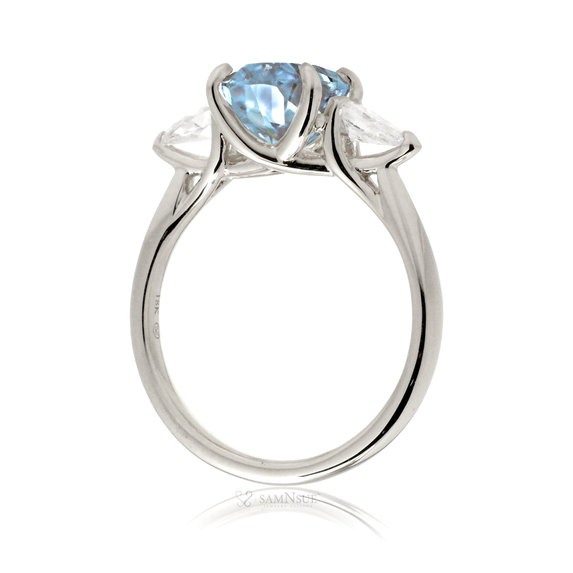 Oval aquamarine proposal ring with pear side diamonds white gold