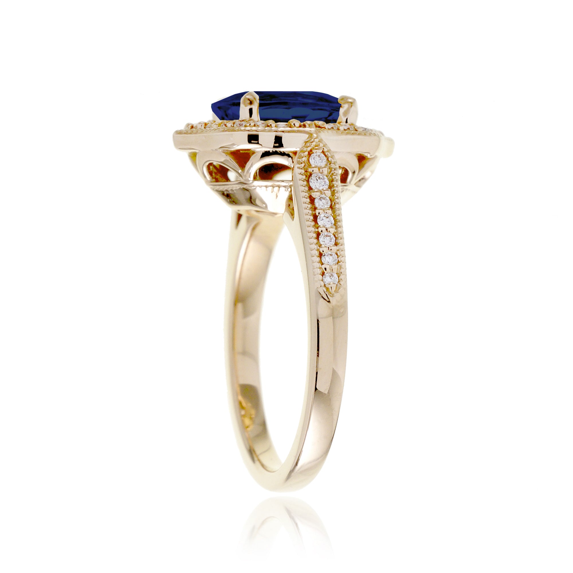 Vintage Oval Blue Sapphire and Diamond Halo Ring in Yellow Gold