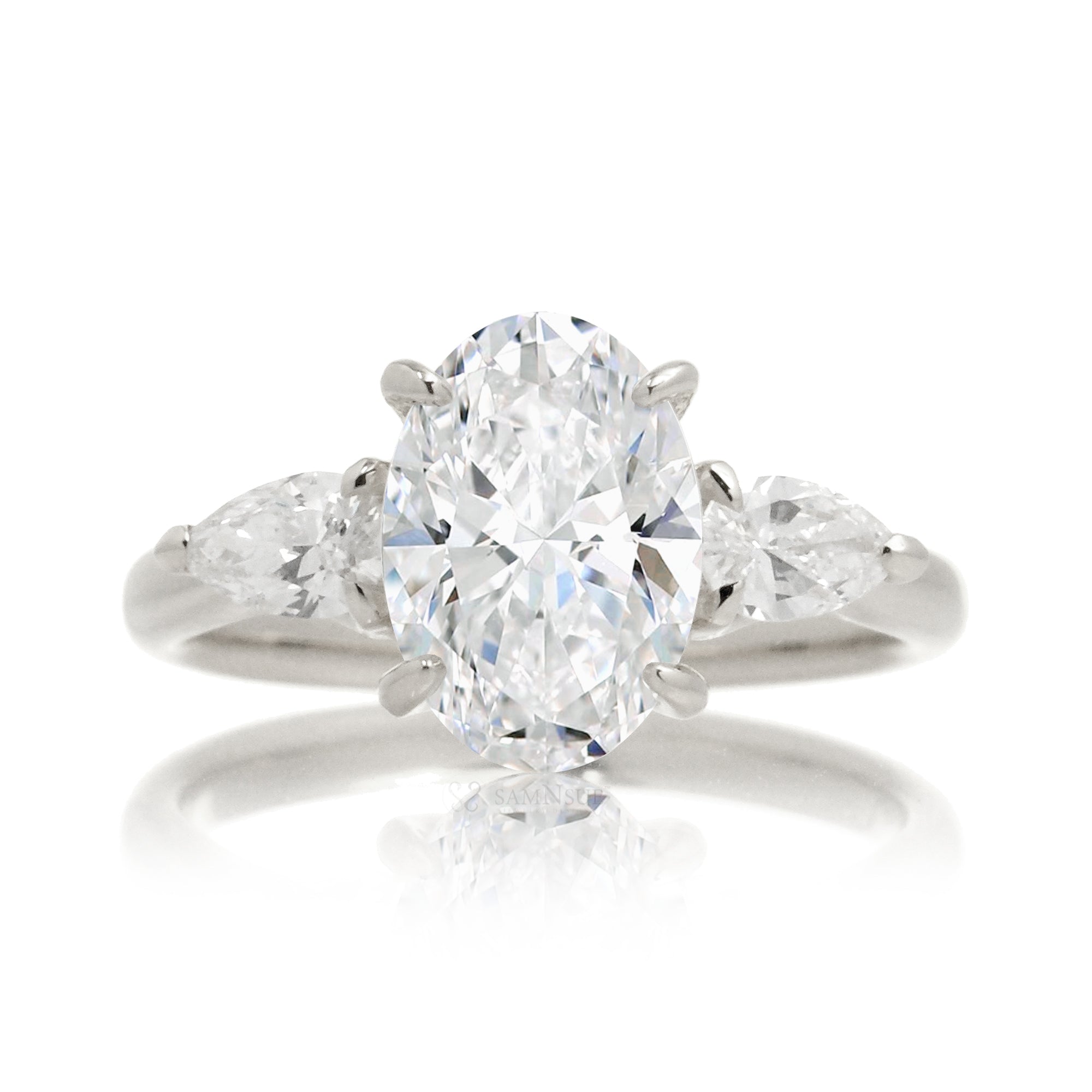 Pear side stone engagement ring in white gold or platinum