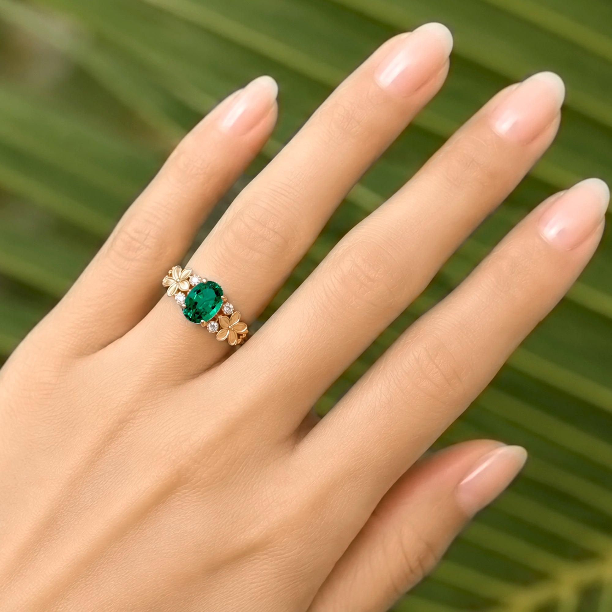 Oval emerald diamond ring with plumeria flower island style yellow gold