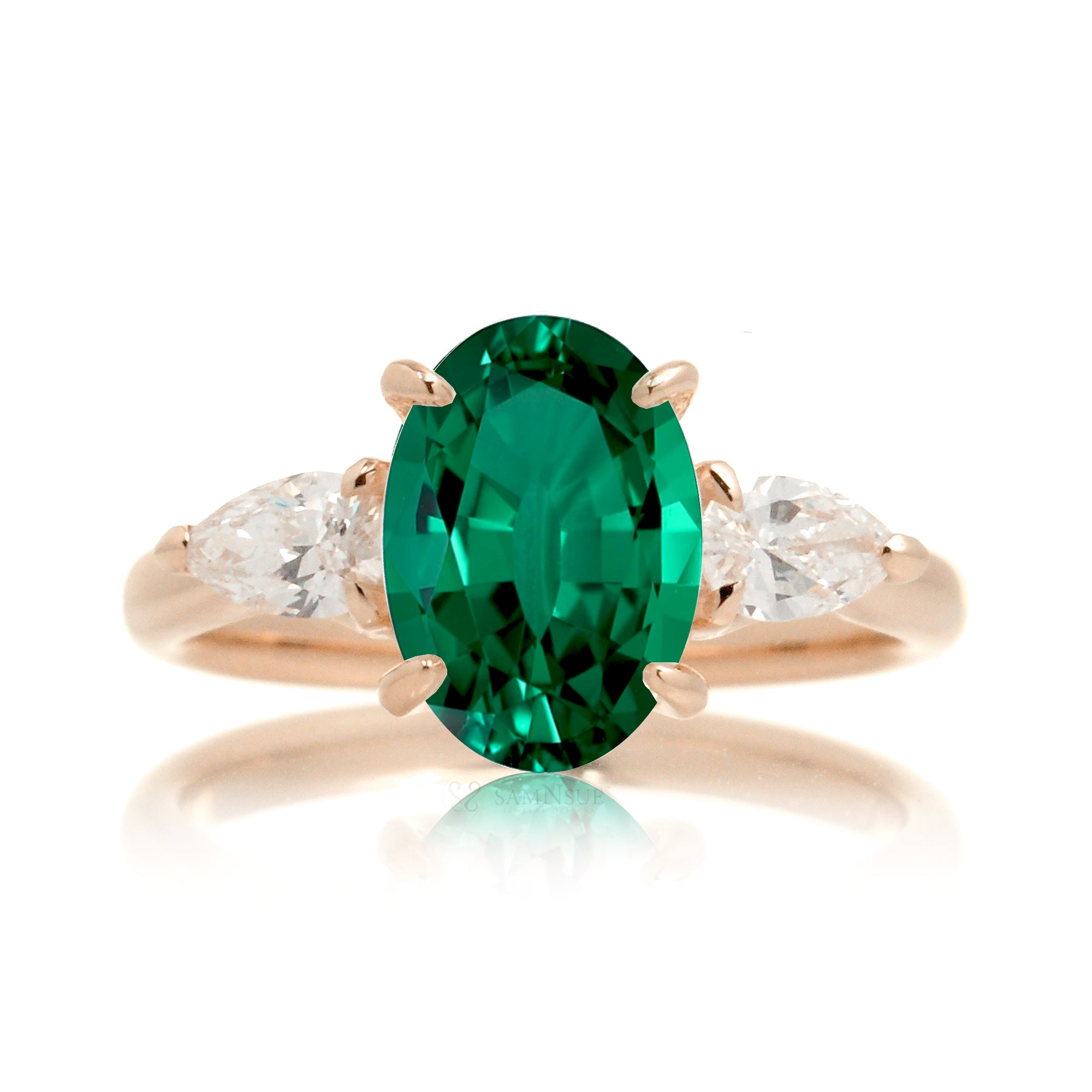 Oval cut green emerald three stone pear diamond ring rose gold