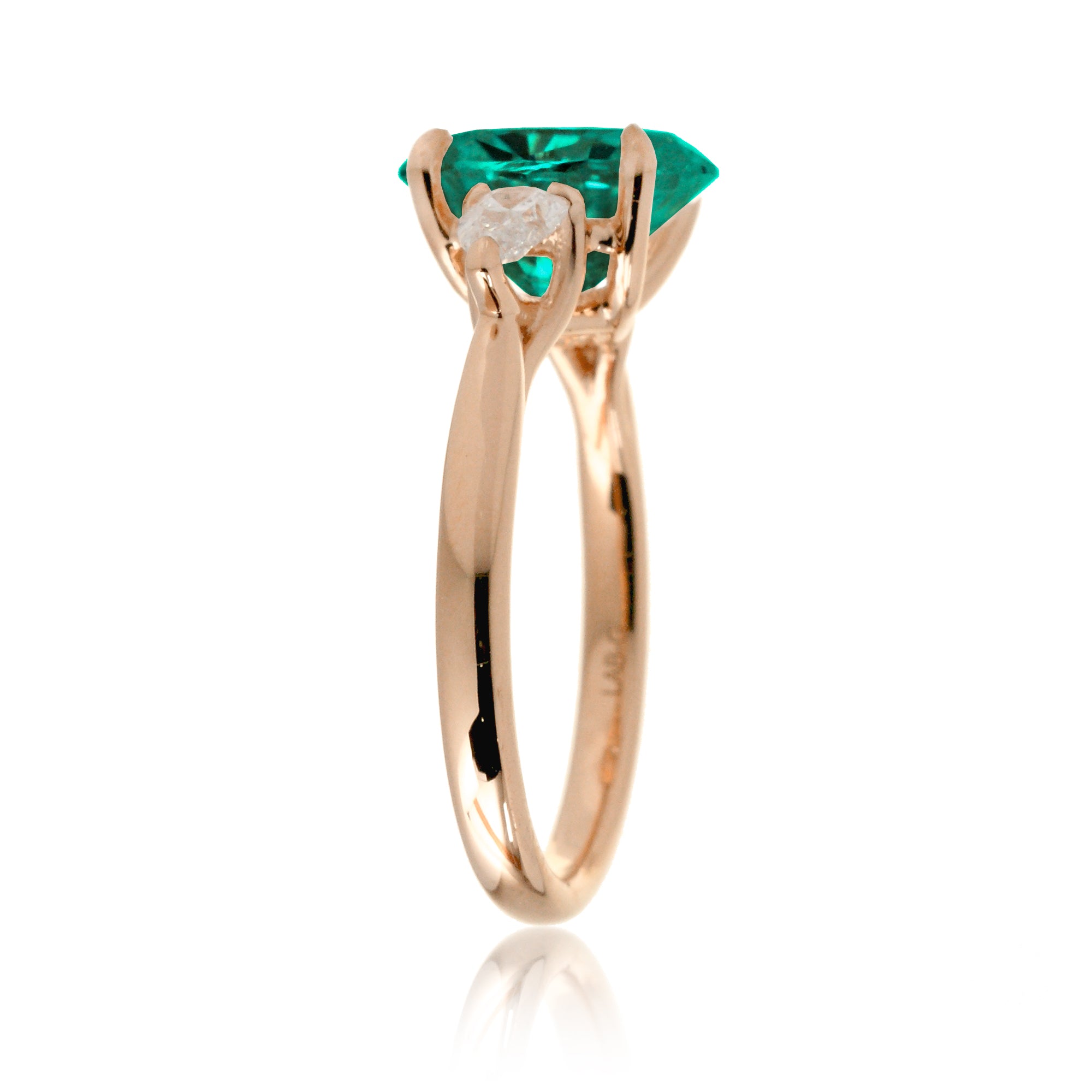 Oval cut green emerald three stone pear diamond ring rose gold