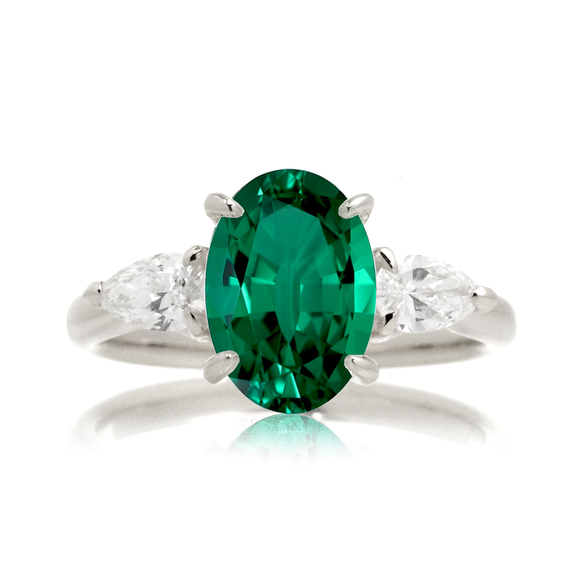 Oval cut green emerald three stone pear diamond ring white gold