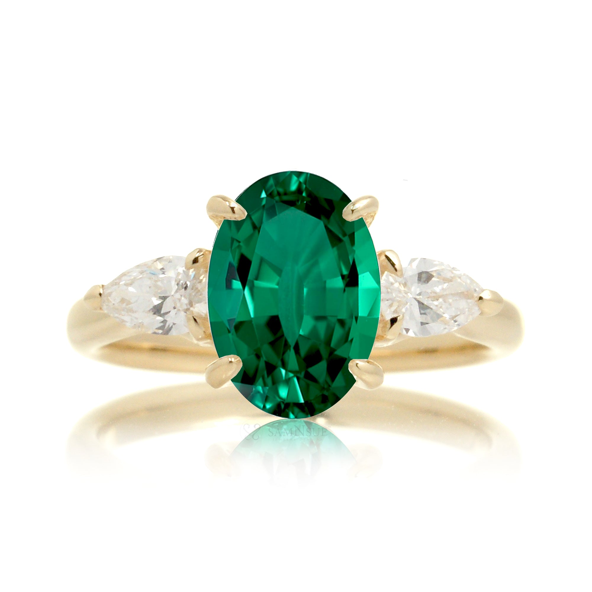 Oval cut green emerald three stone diamond ring yellow gold