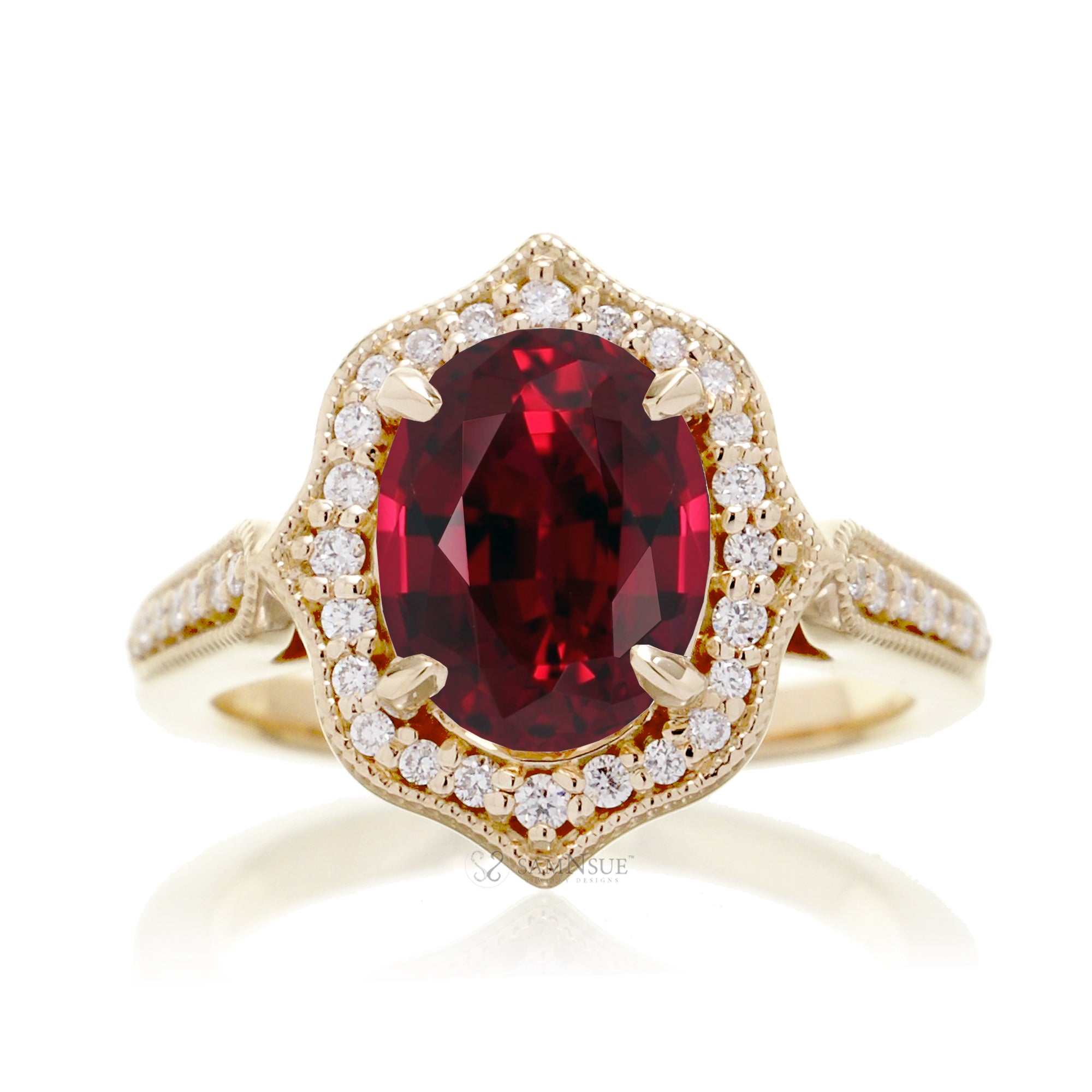Vintage Oval Ruby and Diamond Halo Ring in Yellow Gold